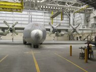 Airmen from the 62nd Maintenance Squadron spent more than two months repainting a C-130 Hercules in the Vietnam-era camouflage scheme.  The aircraft was painted for the McChord Air Museum and will be on display in the McChord Air Park in the near future. (Courtesy photo)