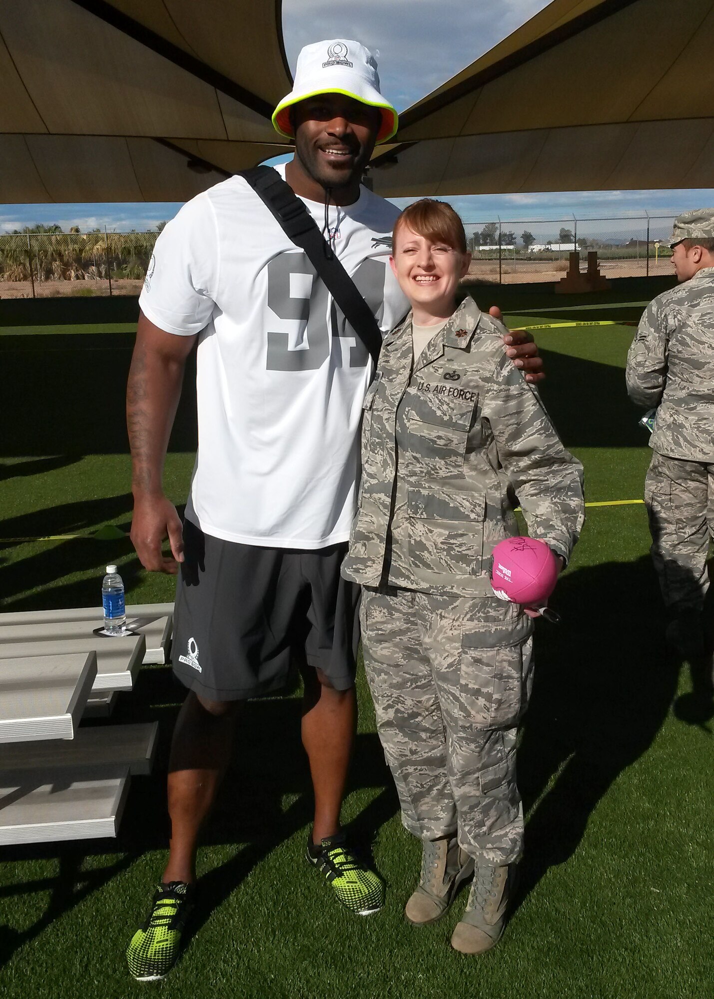 Maj. Elizabeth Magnusson, 944th Fighter Wing public affairs chief, takes a photo with Mario Williams, National Football League Buffalo Bills defensive end, Jan 21 during a visit to Luke Air Force Base, Ariz. (U.S. Air Force photo by Tech. Sgt. Louis Vega Jr.)