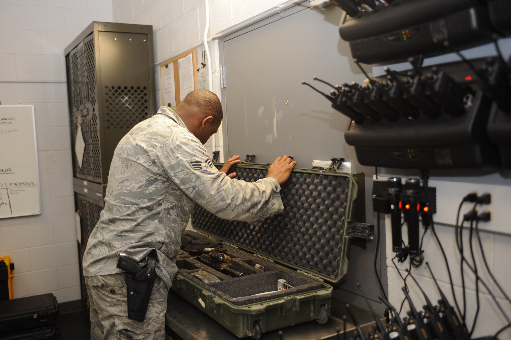 U.S. Air Force Senior Airman Deiron Armstead, 355th Security Forces Squadron arms room attendant, prepares a deployment case at the armory at Davis-Monthan Air Force Base, Ariz., Jan. 20, 2015. The deployment cases contain the weapon, magazines, blank firing adapters as well as inspection logs. (U.S. Air Force photo by Airman 1st Class Cheyenne Morigeau/Released)