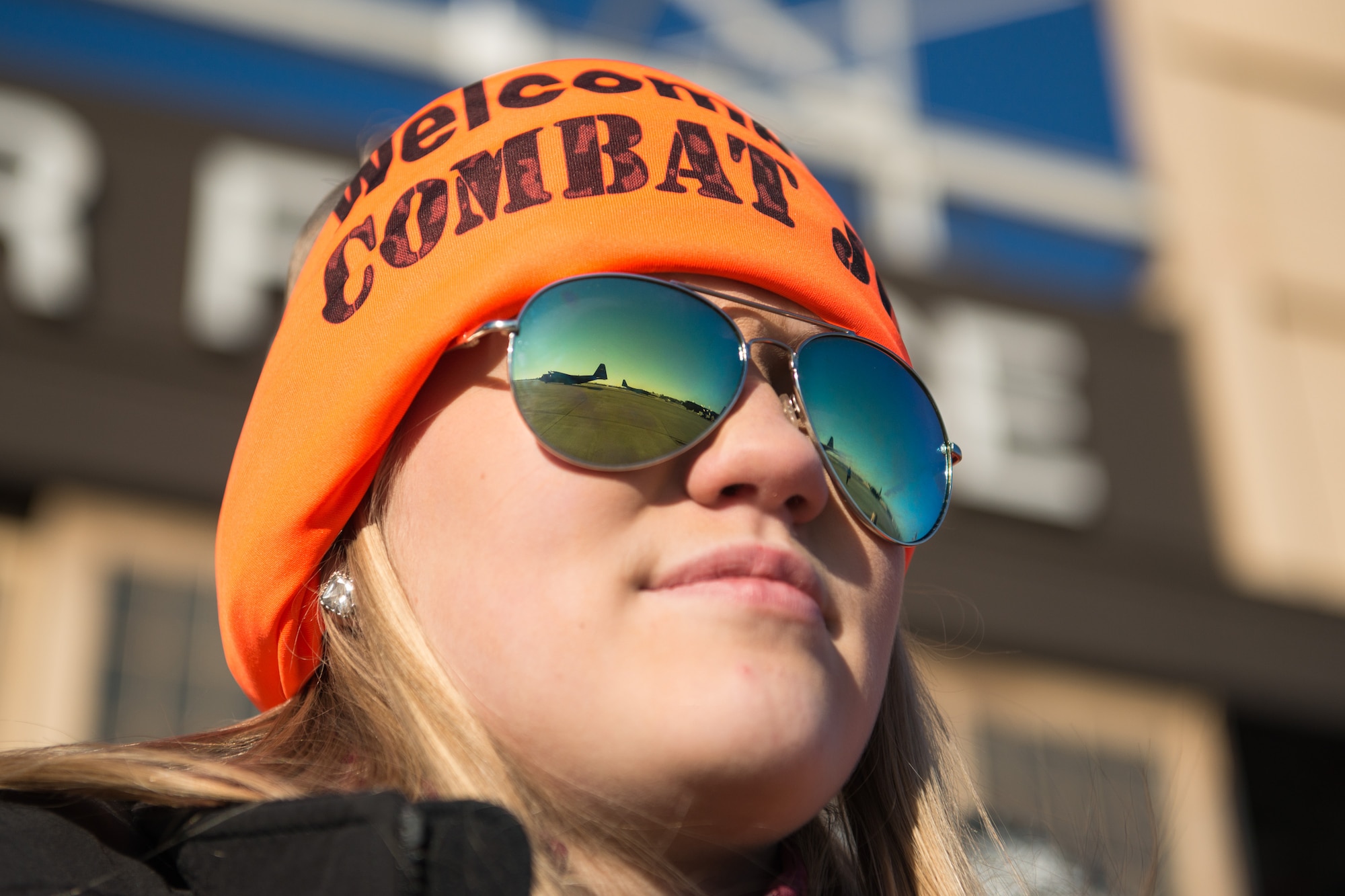 Family and friends of Chief Master Sgt. Orin Johnson, 934th Operations Group, watch the aircraft as they wait for the deployers to arrive home. The 934th Airlift Wing welcomed home Airmen to the Minneapolis-St. Paul Air Reserve Station, Minn., Jan. 18. (U.S. Air Force photo by Staff Sgt. Trevor Saylor/Released)