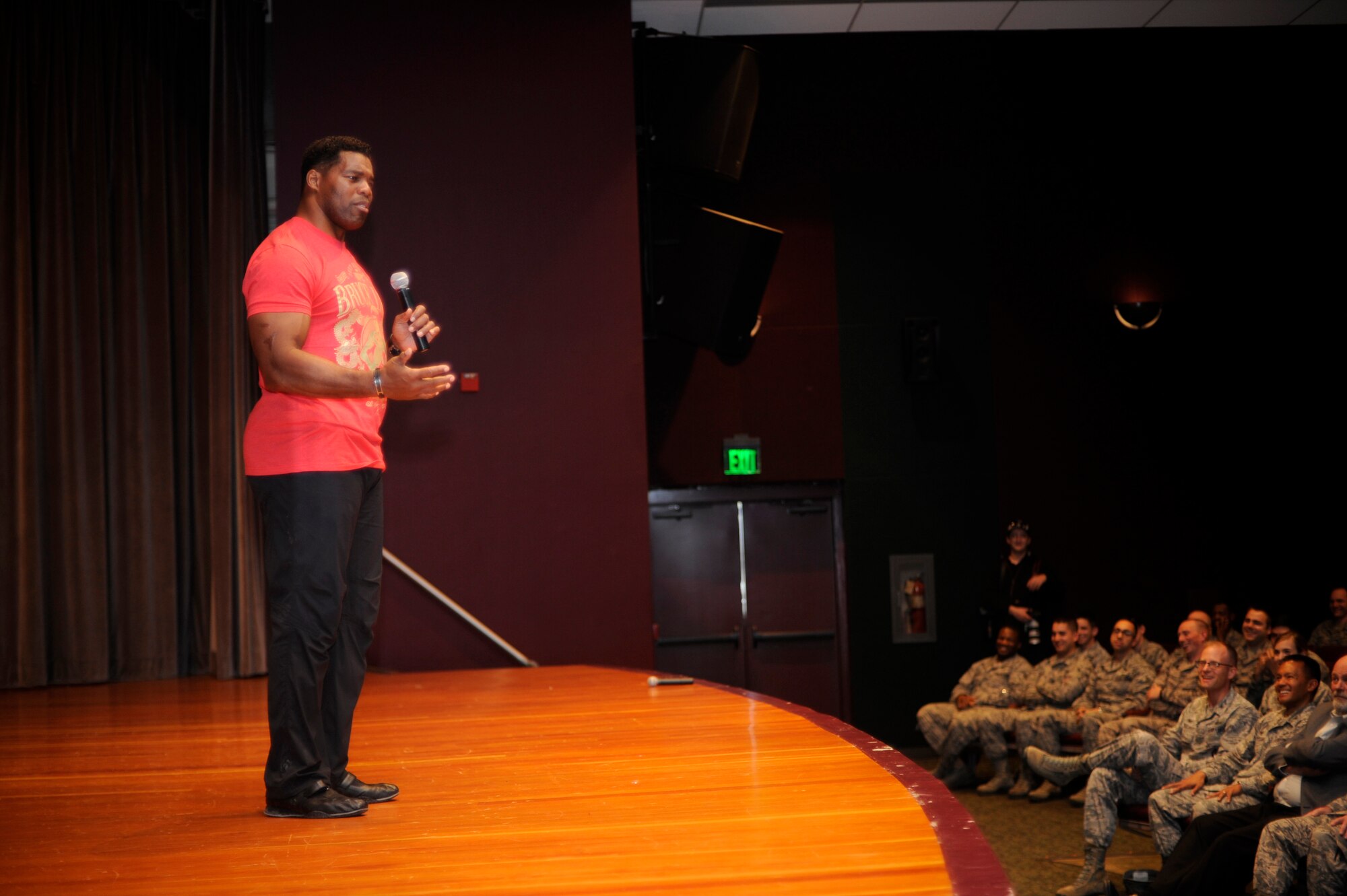 Herschel Walker, professional athlete and businessman, shares his story withTeam Vandenberg during an All Call, Jan. 21, 2015, Vandenberg Air Force Base, Calif. Walker visits military installations to share his personal story and raise unit morale. (U.S. Air Force photo by Staff Sgt. Jim Araos/Released)