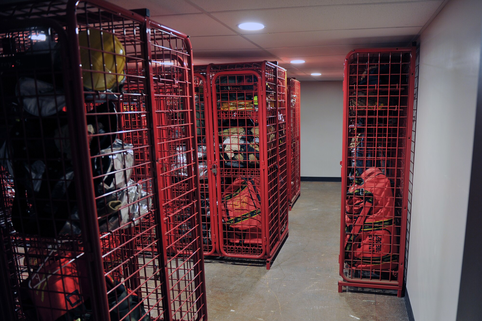 ALTUS AIR FORCE BASE, Okla. – Personal protective equipment for members of the 97th Civil Engineer Squadron Fire Department rests in assigned wall lockers inside the newly enclosed mezzanine Jan. 22, 2015. The renovation to enclose the mezzanine was completed by the 97th structures, heating ventilation and air conditioning and electrical shops. By having the 97th complete the renovations, the Air Force saved an estimated $92,000 in contracting costs. (U.S. Air Force photo by Senior Airman Dillon Davis/Released)