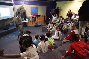 2nd Lt. Joshua Van Abel, 11th Logistics Readiness Squadron officer, quizzes Team Andrews school children on the facts about Dr. Rev. Martin Luther King Jr. and the history of the Civil Rights Movement on Joint Base Andrews, Md., Jan. 21, 2015. The base Youth Center hosted an educational event for approximately 170 children to learn about the significance of MLK Day. (U.S. Air Force photo/Airman 1st Class Joshua R. M. Dewberry)