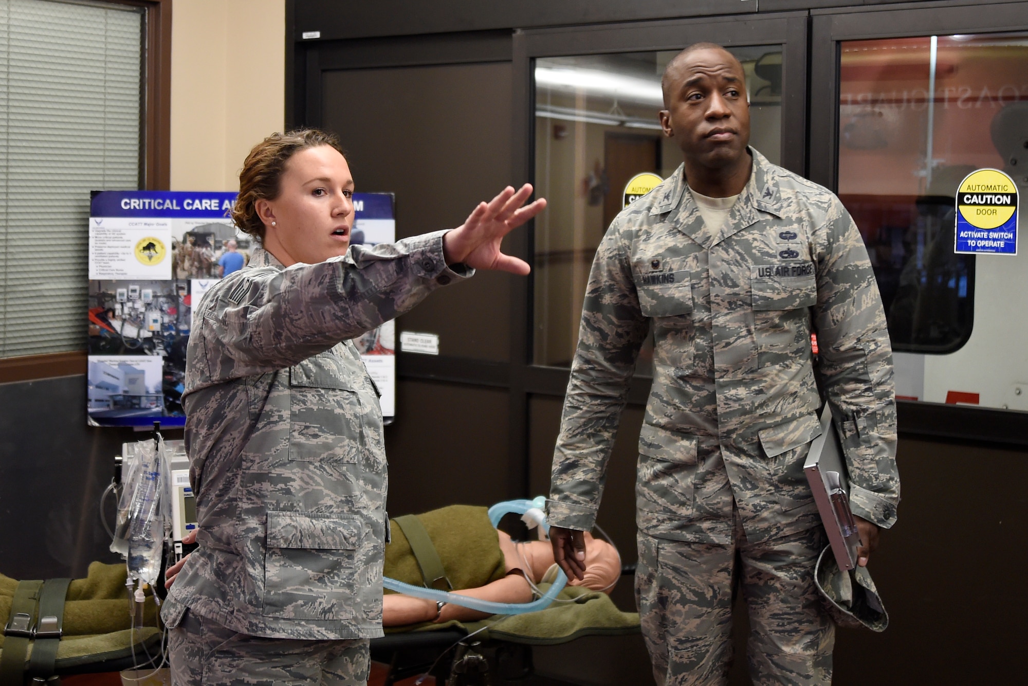 Staff Sgt. Holly Mason, 779th Aeromedical Staging Flight NCO in-charge of Clinical Operations, briefed Col. Stacey Hawkins, 10th Air Base Wing commander, on the unique mission of the ASF on Joint Base Andrews, Md., Jan. 13, 2015. (U.S. Air Force photo/Airman 1st Class Ryan J. Sonnier)