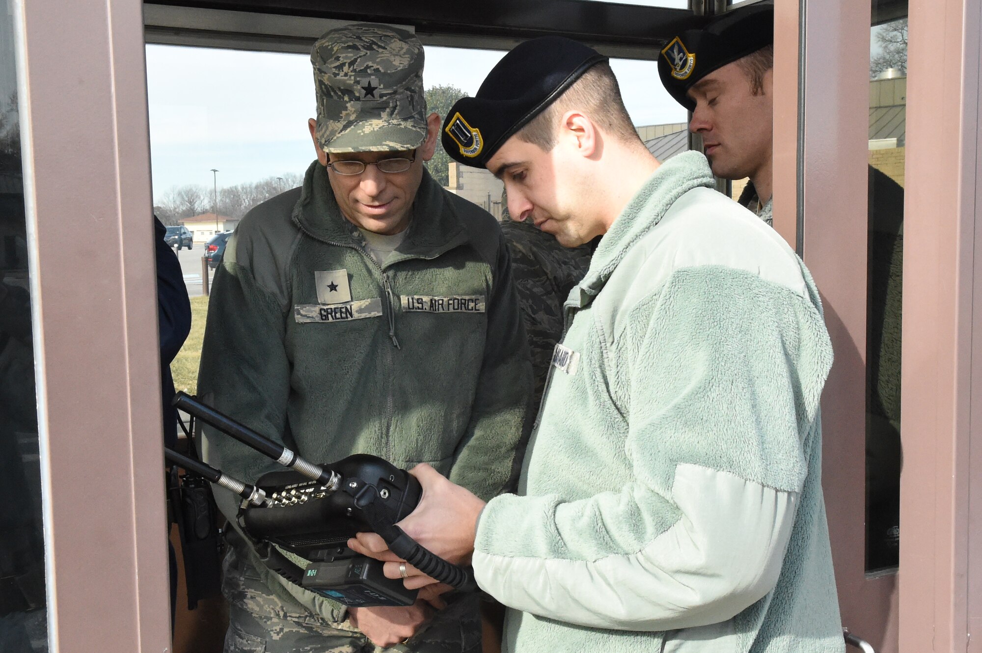 Brig. Gen. Timothy Green, Air Force Director of Civil Engineers, is shown operating procedures for gate guards during the Commander-in-Chief’s Installation Excellence Award evaluation at Joint Base Andrews, Md., Jan. 13, 2015.  (U.S. Air Force photo/Airman 1st Class Joshua R. M. Dewberry)