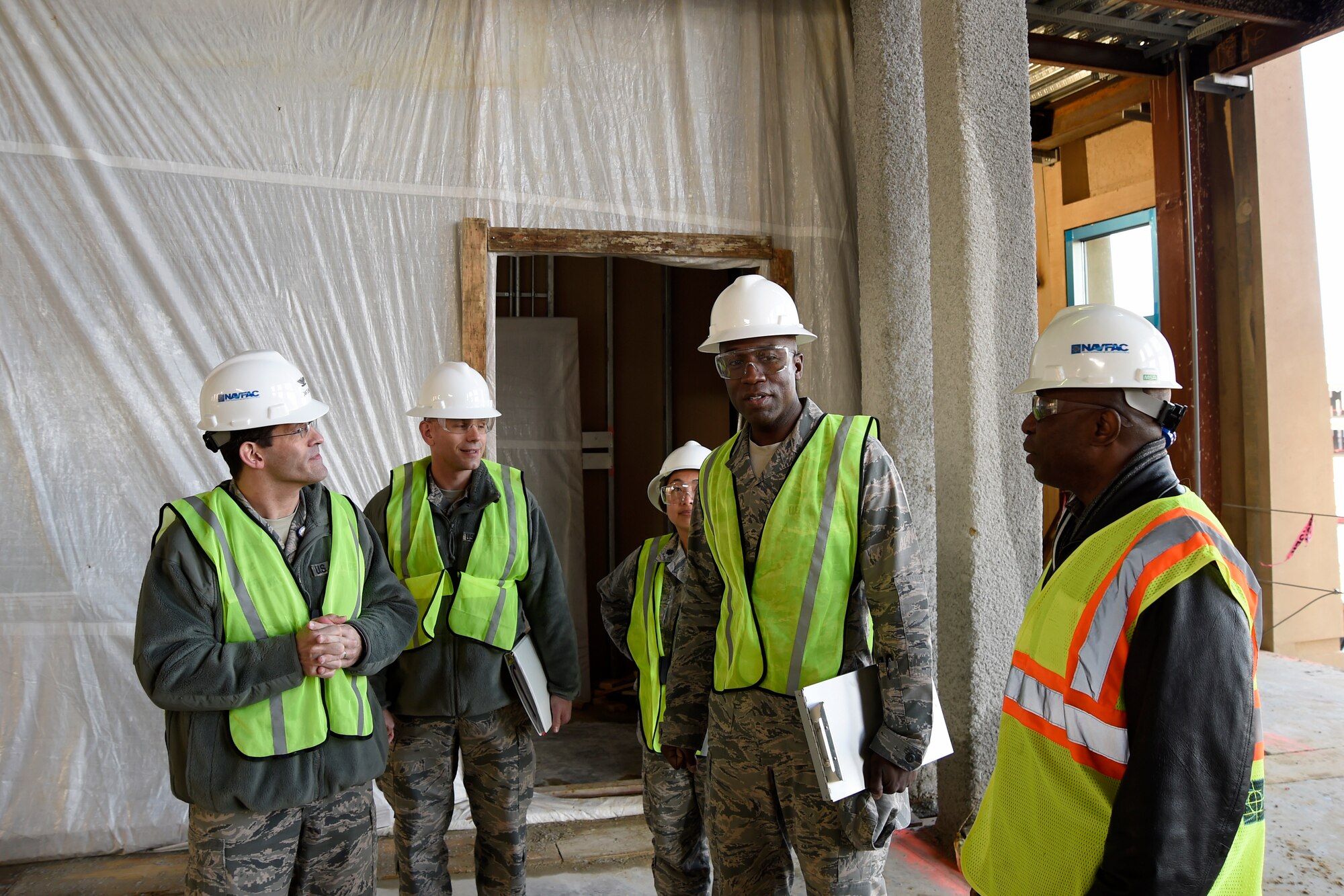 Col. Stacey Hawkins (second from the right), 10th Air Base Wing commander, receives a tour of the construction site at Malcolm Grow Medical Center on Joint Base Andrews, Md., Jan. 13, 2015. The tour was given to Col. Hawkins during the Commander-in-Chief’s Installation Excellence Award visit. (U.S. Air Force photo/Airman 1st Class Ryan J. Sonnier)