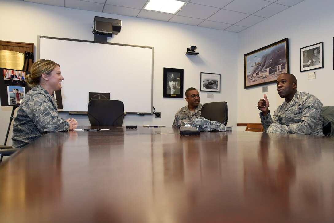 Col. Stacey Hawkins (right), 10th Air Base Wing commander, gives a thumbs-up during a briefing on the duties of the 11th Wing Public Affairs from Capt. Erika Wonn (left), 11th Wing PA officer, on Joint Base Andrews, Md., Jan. 12, 2015. The brief was part of the Commander-in-Chief’s Installation Excellence Award visit. (U.S. Air Force photo/Airman 1st Class Ryan J. Sonnier)