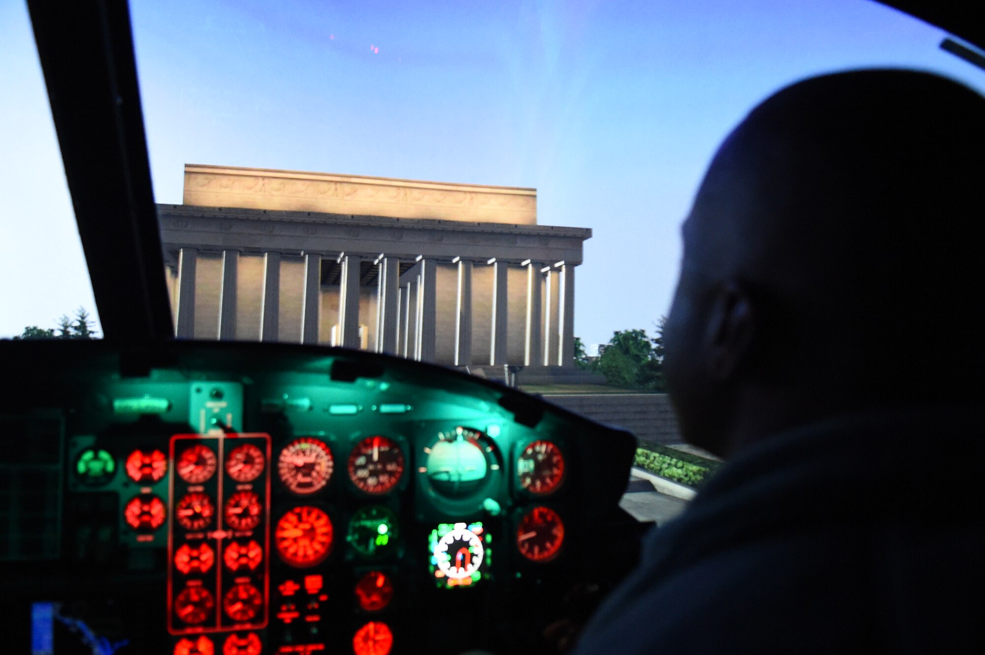 Col. Stacey Hawkins, 10th Air Base Wing commander, sits in flight simulator demonstration on Joint Base Andrews, Md., Jan. 12, 2015. The demonstration was part of the Commander-in-Chief’s Installation Excellence Award visit. (U.S. Air Force photo/Airman 1st Class Joshua R. M. Dewberry)