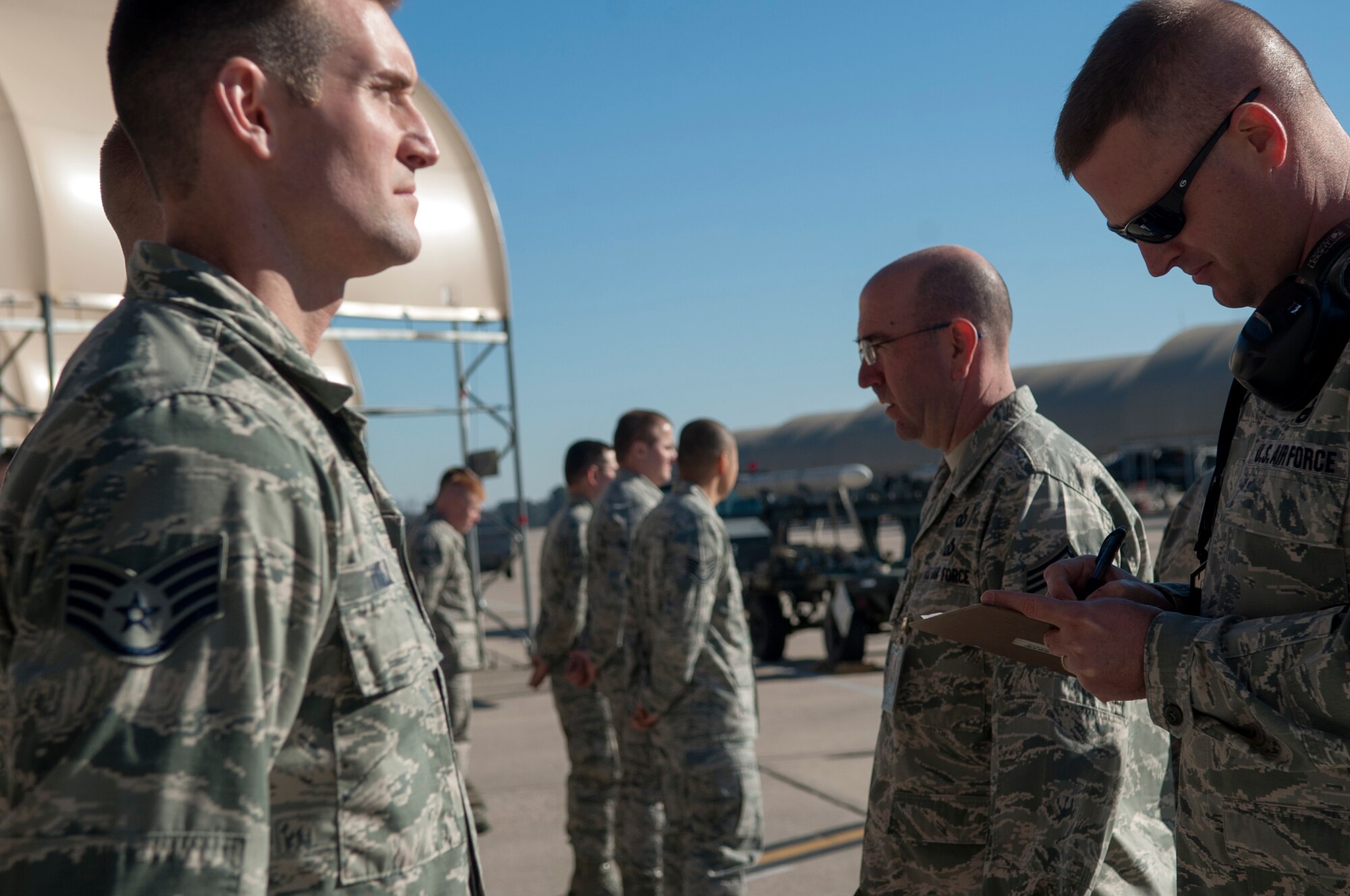 Chief Master Sgt. Jeffrey Craver, 4th Fighter Wing command chief, conducts a dress and appearance inspection during a Dedicated Eagle Keeper competition at Seymour Johnson Air Force Base, North Carolina, Jan. 16, 2015. The results of the competition will be officially announced Feb. 20 during a ceremony with awards presented by Col. Darrell Steele, 4th MXG commander. (U.S. Air Force photo/Airman Shawna L. Keyes)