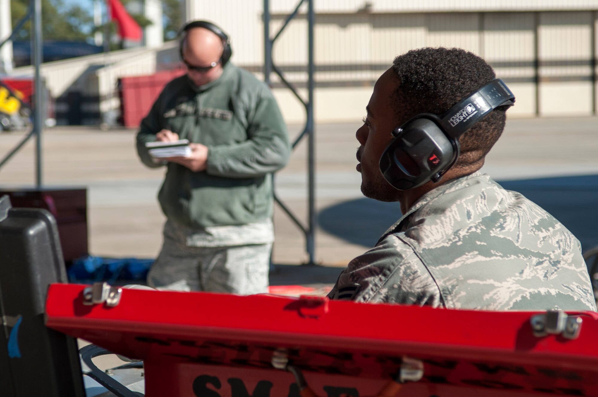 Senior Airman Jacquan Smith (right), 4th Aircraft Maintenance Squadron avionics technician, is evaluated by Tech. Sgt. David Todd, 4th Maintenance Group weight and balance manager, during a Dedicated Eagle Keeper competition at Seymour Johnson Air Force Base, North Carolina, Jan. 16, 2015. 20 Airmen assigned to the 4th MXG competed in the competition. (U.S. Air Force photo/Airman Shawna L. Keyes)