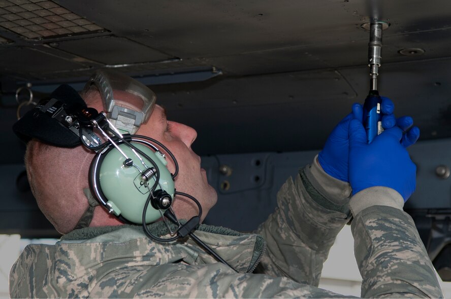 Senior Airman Charles Brumley, 4th Aircraft Maintenance Squadron crew chief, tightens a bolt during a Dedicated Eagle Keeper competition at Seymour Johnson Air Force Base, North Carolina, Jan. 16, 2015. Each aircraft maintenance unit uses their best aircraft and selects their most accomplished maintainers to compete. Evaluated by quality assurance personnel, the contest features challenges tailored for crew chiefs and other maintenance specialists. The competition consists of a support section challenge, inspecting one tool kit to ensure its contents are serviceable; a dedicated crew chief challenge, servicing a nose strut to ensure the hydraulics and the strut can work properly; and an avionics pod challenge, properly installing a Sniper targeting pod. All participants also take a knowledge test. Factors evaluated include time, accuracy, abiding by technical data and safety. The results of the competition will be officially announced Feb. 20 during a ceremony with awards presented by Col. Darrell Steele, 4th Maintenance Group commander. (U.S. Air Force photo/Airman Shawna L. Keyes) 