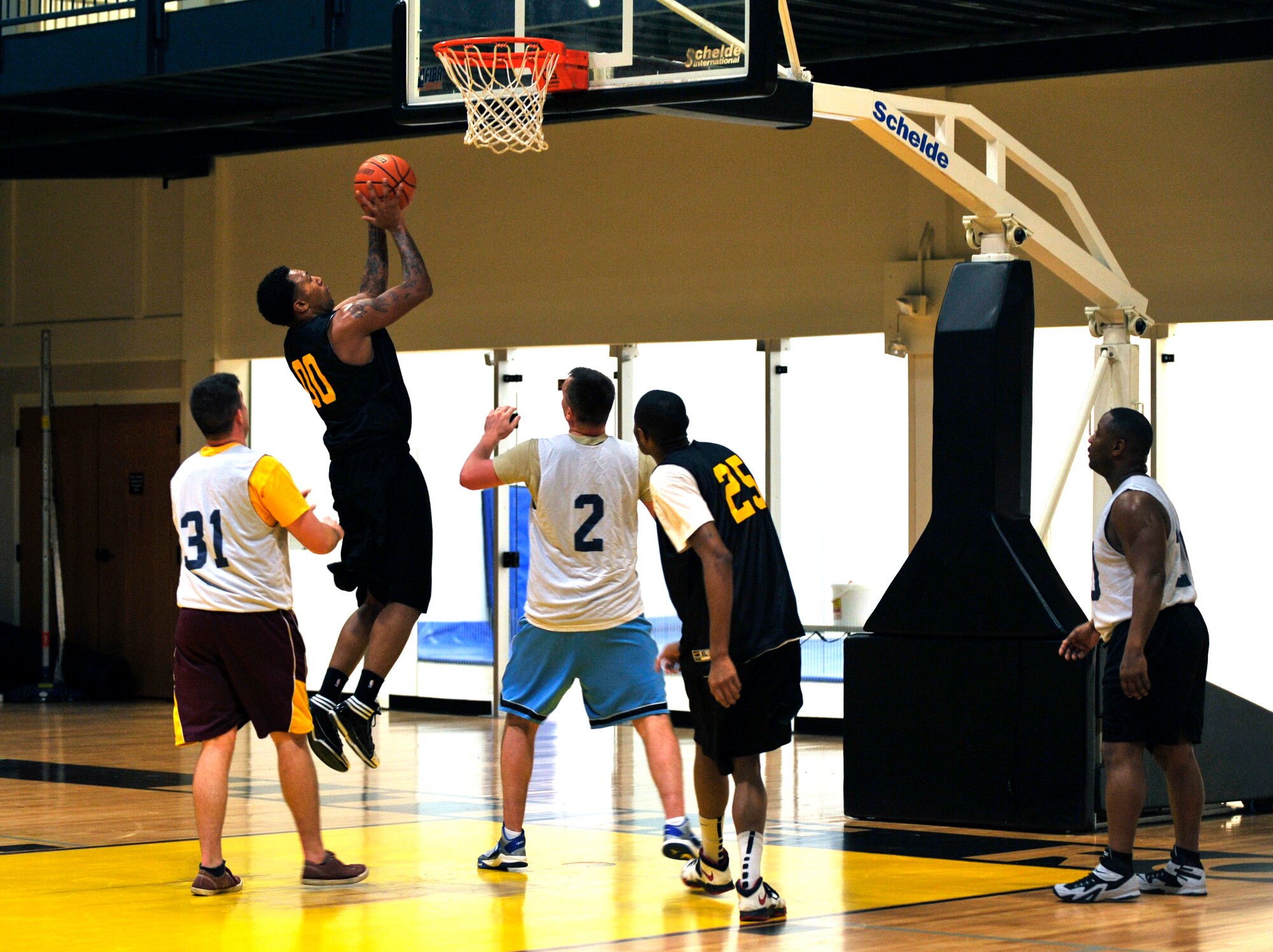 An Army National Guard player attempts to score Jan. 15, 2015, at Little Rock Air Force Base, Ark. The Army National Guard played against the 19th Comptroller/Contracting Squadron. (U.S. Air Force photo by Senior Airman Stephanie Serrano)