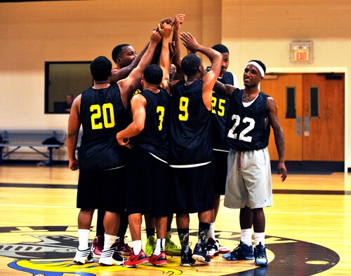 The Army National Guard intramural team celebrate their victory Jan. 15, 2015, at Little Rock Air Force Base, Ark. The Army National Guard defeated the 19th Comptroller/ Contracting Squadron, 83-53. (U.S. Air Force photo by Senior Airman Stephanie Serrano)
