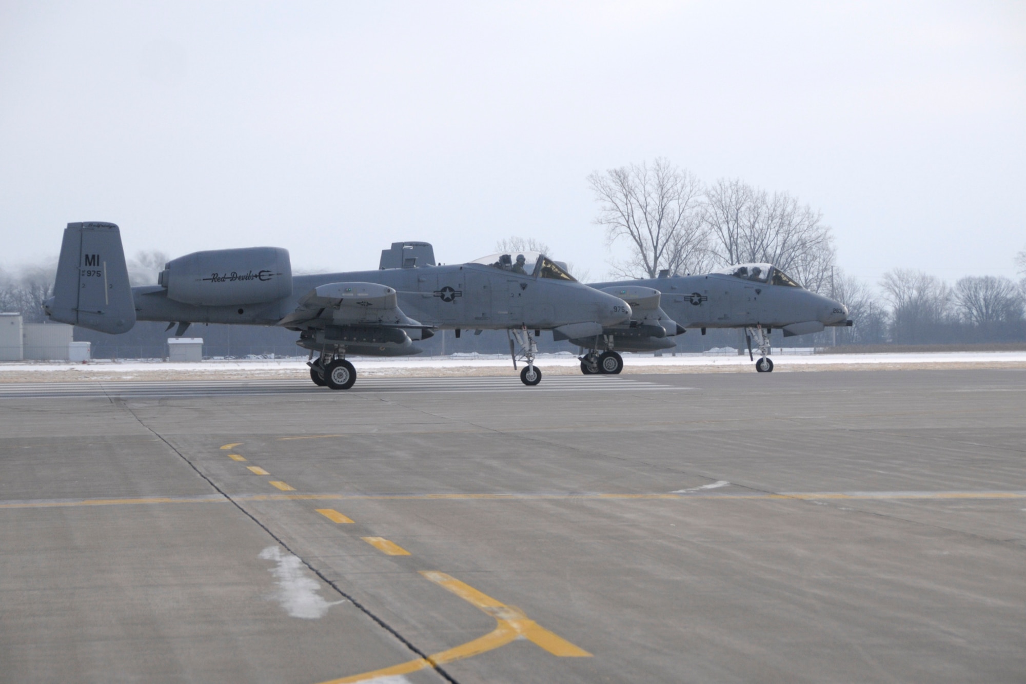 127th Wing A-10 Thunderbolt II aircraft prepare to takeoff to Operation Snowbird at Davis-Monthan AFB, Ariz., on Friday, January 23.   Operation Snowbird allows military flying units to take advantage of the optimal weather conditions and live-fire ranges available in southern Arizona during the winter months, when home station training may be hampered by snow and ice. About 200 Airmen and 10 jets from the 127th Wing deployed and will support this year's operation.  (U.S. Air National Guard photo by Brittani Baisden)