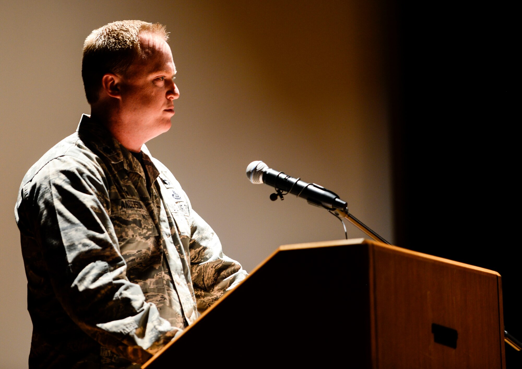 U.S. Air Force Lt. Col. Neil Anderson, 10th Intelligence Squadron commander, addresses a crowd during a memorial service at Langley Air Force Base, Va., Jan. 16, 2015. The memorial was held for Senior Airman Andre Jackson, 10th Intelligence Squadron client systems technician, who passed away on Dec. 18, 2014. (U.S. Air Force photo by Senior Airman Kayla Newman/Released) 