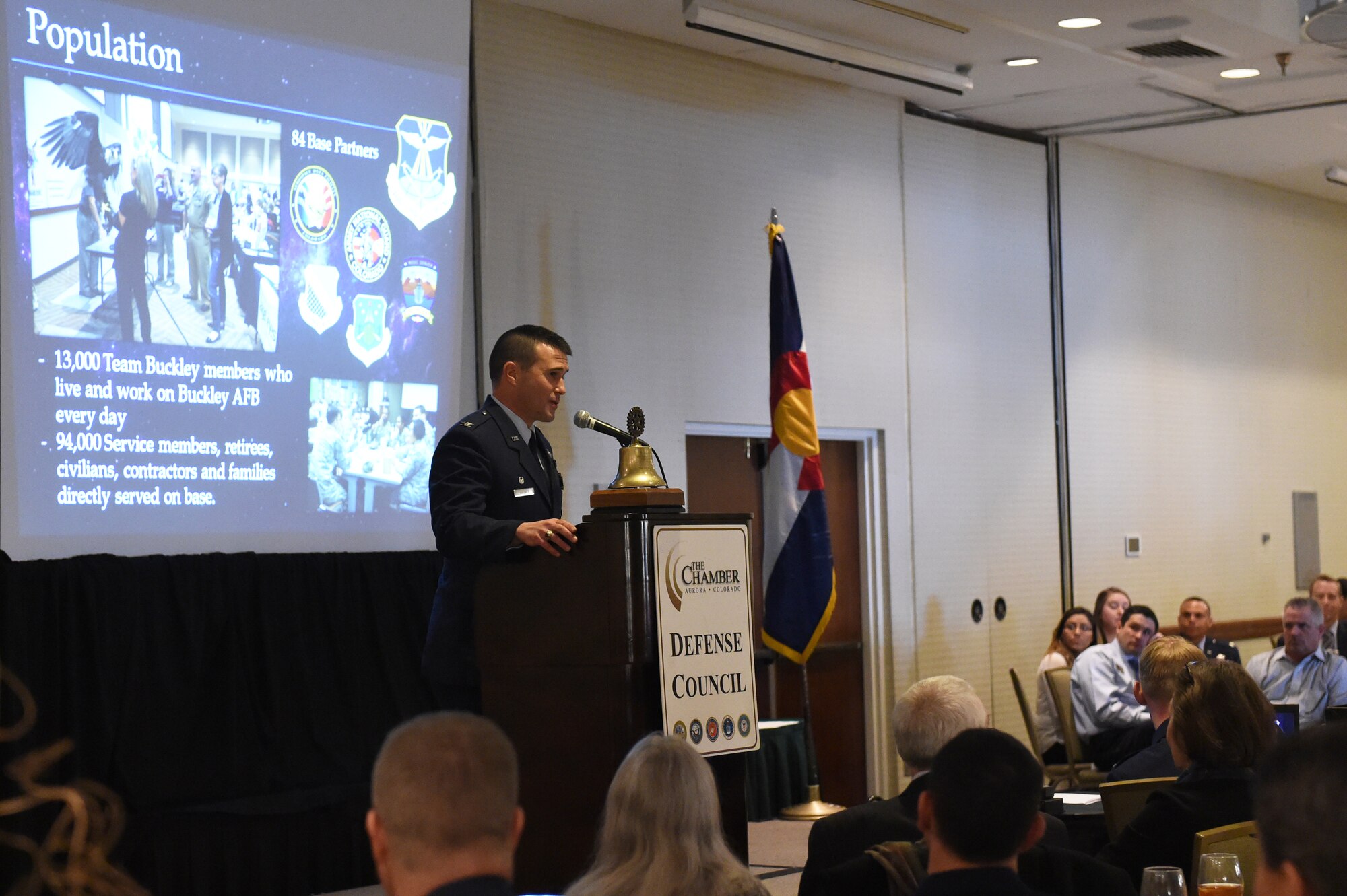 Col. John Wagner, 460th Space Wing commander, speaks to Aurora community leaders at the State of the Base address Jan. 21, 2015, at the DoubleTree by Hilton in Aurora, Colo. This year’s event included things that had never been done in the past, to include an interactive audience demonstration depicting the complexity of infrared missile detection, as well as a surprise visit from the base’s mascot, Buck Lee. The speech emphasized the base’s affiliation with mission partners, outlined the current and upcoming events for Team Buckley and displayed the base’s economic impact on the community. (U.S. Air Force photo by Airman 1st Class Samantha Saulsbury/Released)