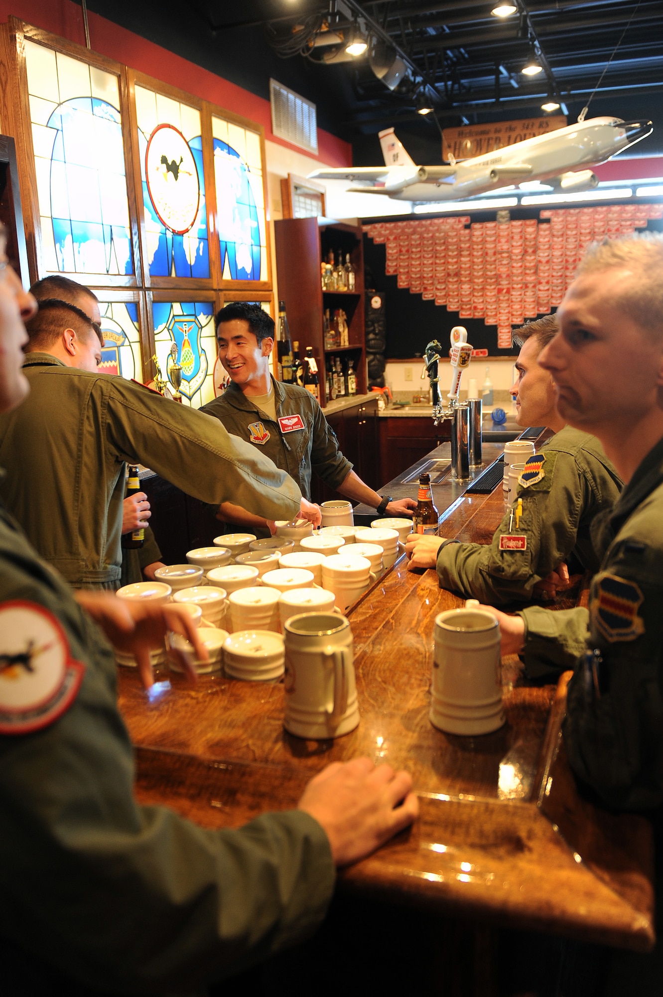 Airmen assigned to the 343rd Reconnaissance Squadron assemble in their heritage room on Jan. 15, Offutt Air Force Base, Neb.  The heritage room is named after 55th Wing Hall of Fame member, Robb Lee Hoover.   (U.S. Air Force photo by Josh Plueger/Released)