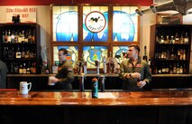 Airmen assigned to the 343rd Reconnaissance Squadron assemble in their heritage room on Jan. 15, Offutt Air Force Base, Neb.  The heritage room, also known as Hoover Lounge, is named after 55th Wing Hall of Famer Robb Lee Hoover.  (U.S. Air Force photo by Josh Plueger/Released)