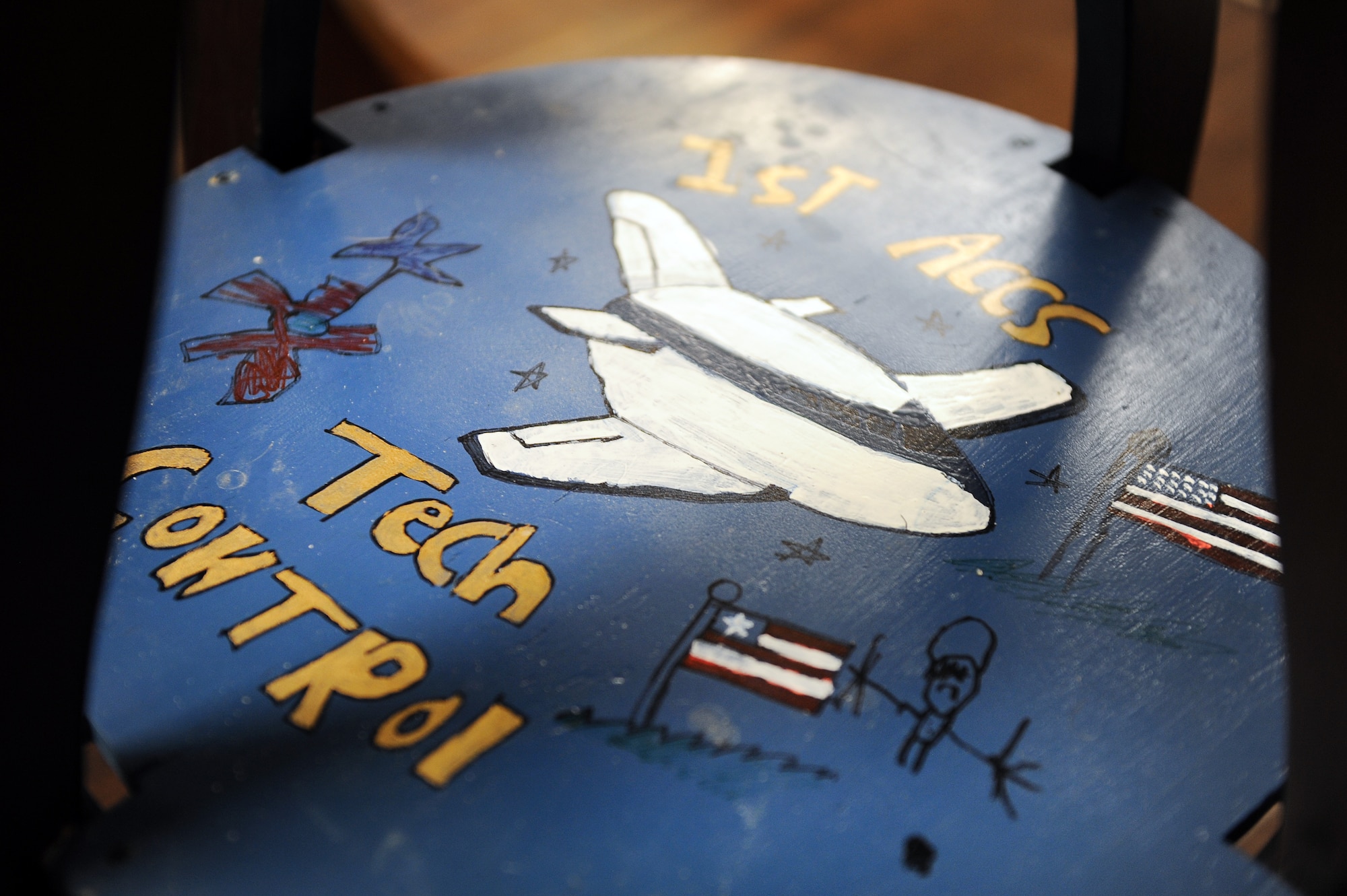 Customized bases highlight each stool throughout the 1st Airborne Command Control Squadron’s heritage room located in the 55th Operations Support Squadron on Jan. 13, Offutt Air Force Base, Neb.  The room is a collaborative effort amongst squadron members either by individual purchase or donations. (U.S. Air Force photo by Josh Plueger/Released)