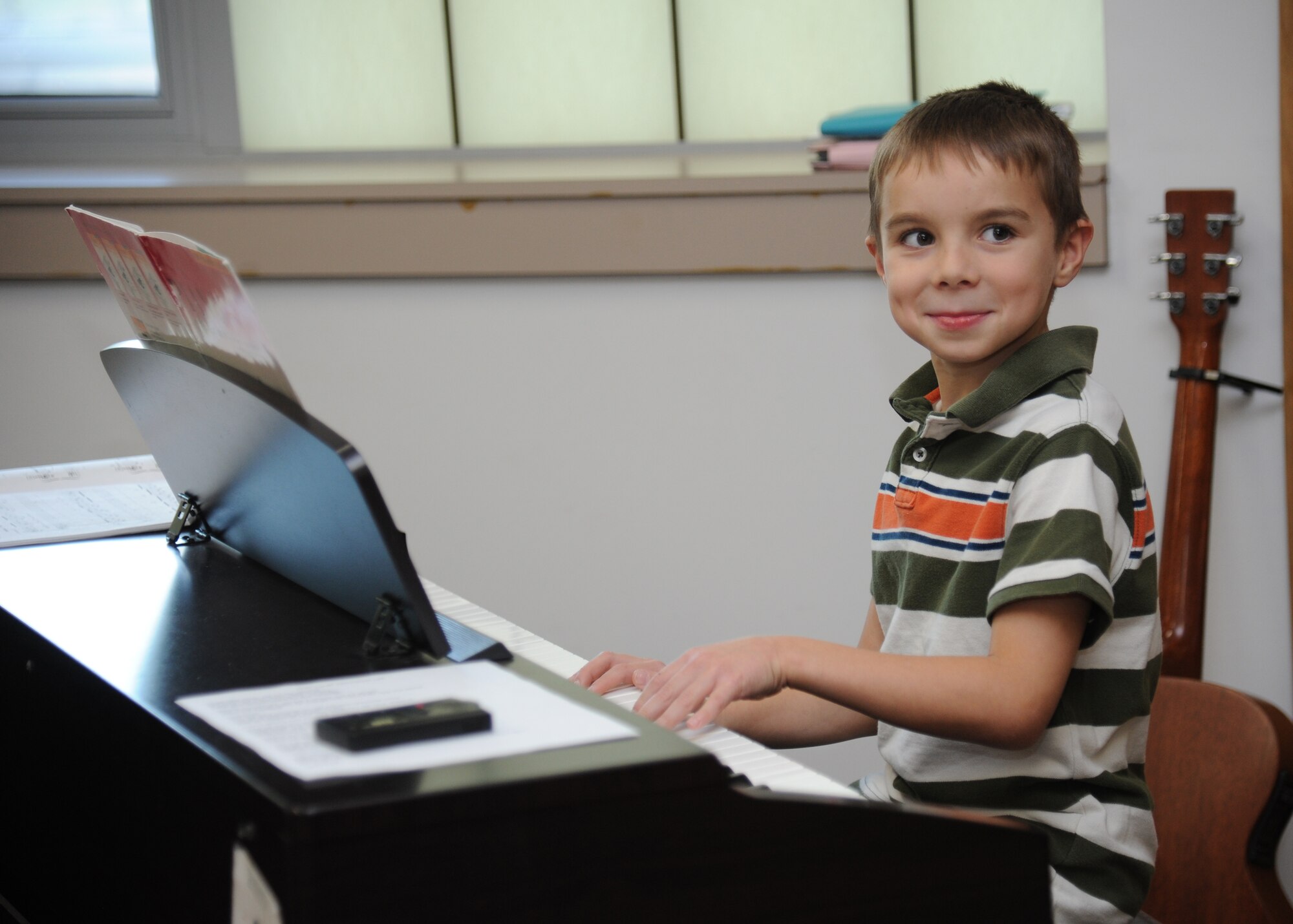 The son of Maj. Jeremiah Parker, 81st Dental Squadron resident, performs “Ode To Joy” during a Biloxi Public School Board meeting Jan. 20, 2015, at the Dukate Building, Biloxi, Miss. The meeting was hosted by Jeff Davis Elementary School who selected talented children to perform for the board, which meets monthly. (U.S. Air Force photo by Kemberly Groue)