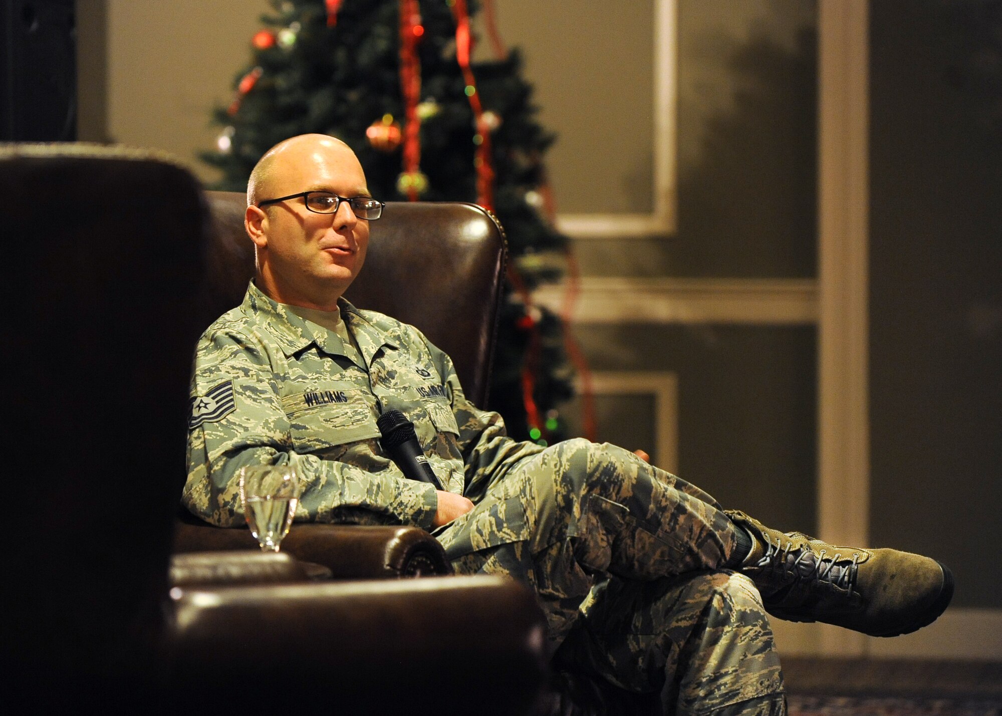 U.S. Air Force Tech. Sgt. Travis Williams, 55th Comptroller Squadron, speaks during the inaugural Story Tellers event called ‘The Long and Short of it’ held on Dec. 16 at the Patriot Club on Offutt Air Force Base, Neb.  Williams stressed the importance of stepping outside of your comfort zone by looking into what the Air Force can offer through special duty assignments.  (U.S. Air Force photo by Josh Plueger/Released)