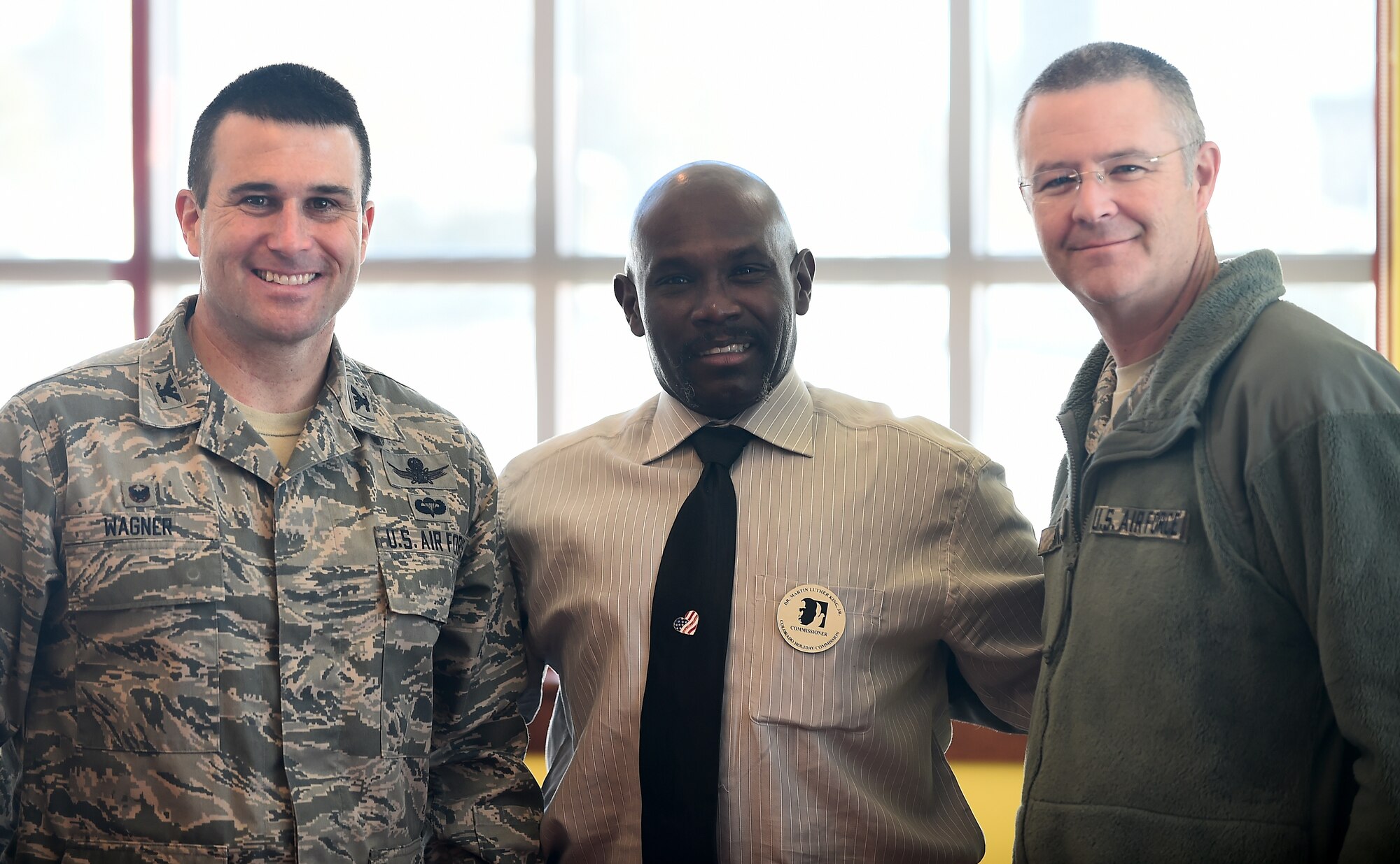 From left, Col. John Wagner, 460th Space Wing commander; Vern L. Howard, Martin Luther King Colorado Holiday Commission chairman; and Col. Michael Kindt, 460th Medical Group commander, commemorated Dr. Martin Luther King Jr. Jan. 22, 2015, at the Panther Den on Buckley AFB, Colo. In remembrance of Martin Luther King, Howard gave a lecture on his life accomplishments.  (U.S. Air Force photo by Airman 1st Class Luke Nowakowski/Released)