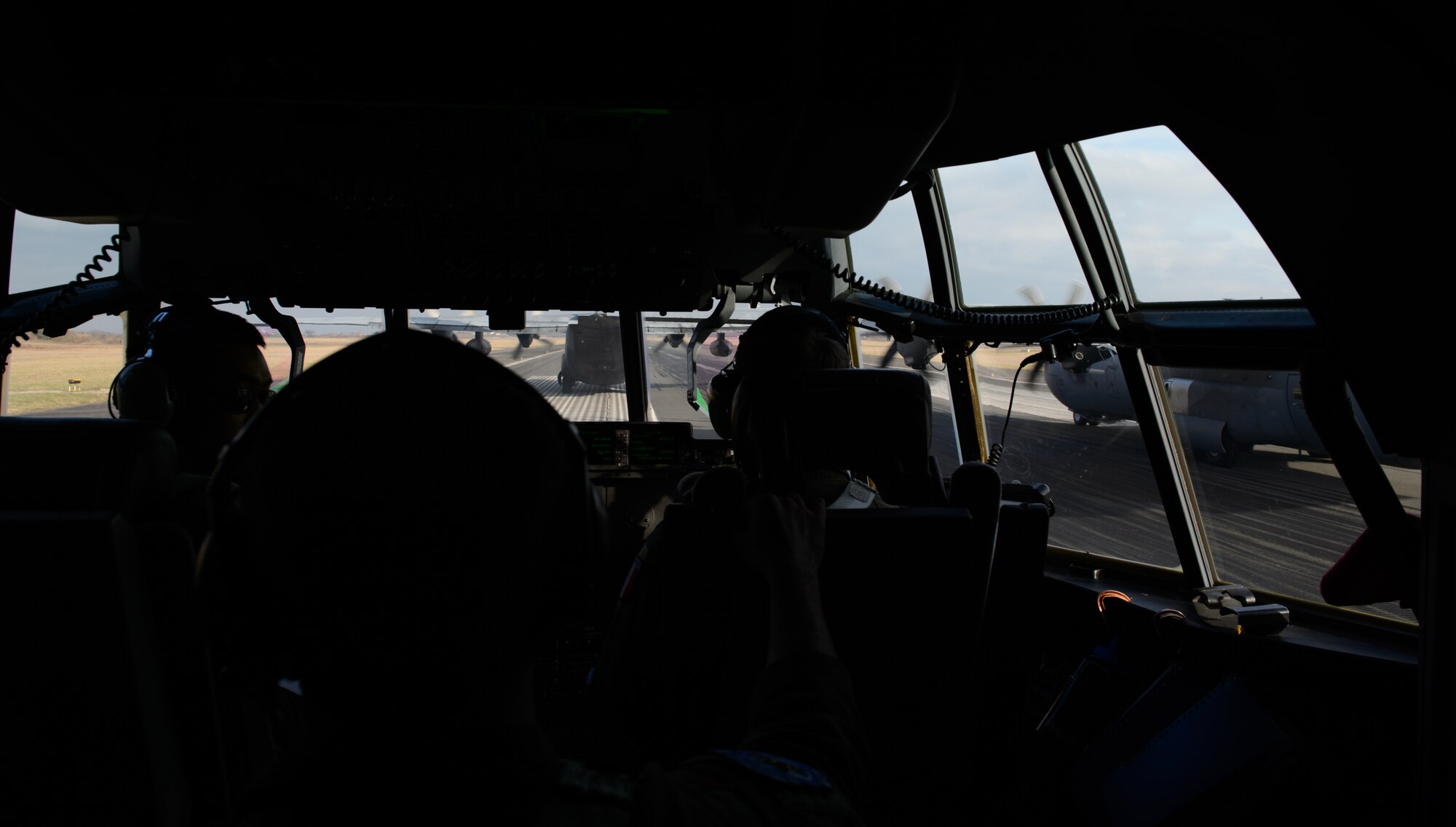 A French C-130H Hercules and two U.S. C-130J Super Hercules perform an elephant walk as they prepare to take off for a tactical airlift mission at Orleans - Bricy Air Base, France, Jan. 21, 2015. The aircraft and its Airmen joined forces to learn, develop and maintain a relationships between the two allies. (U.S. Air Force photo/Senior Airman Armando A. Schwier-Morales)
