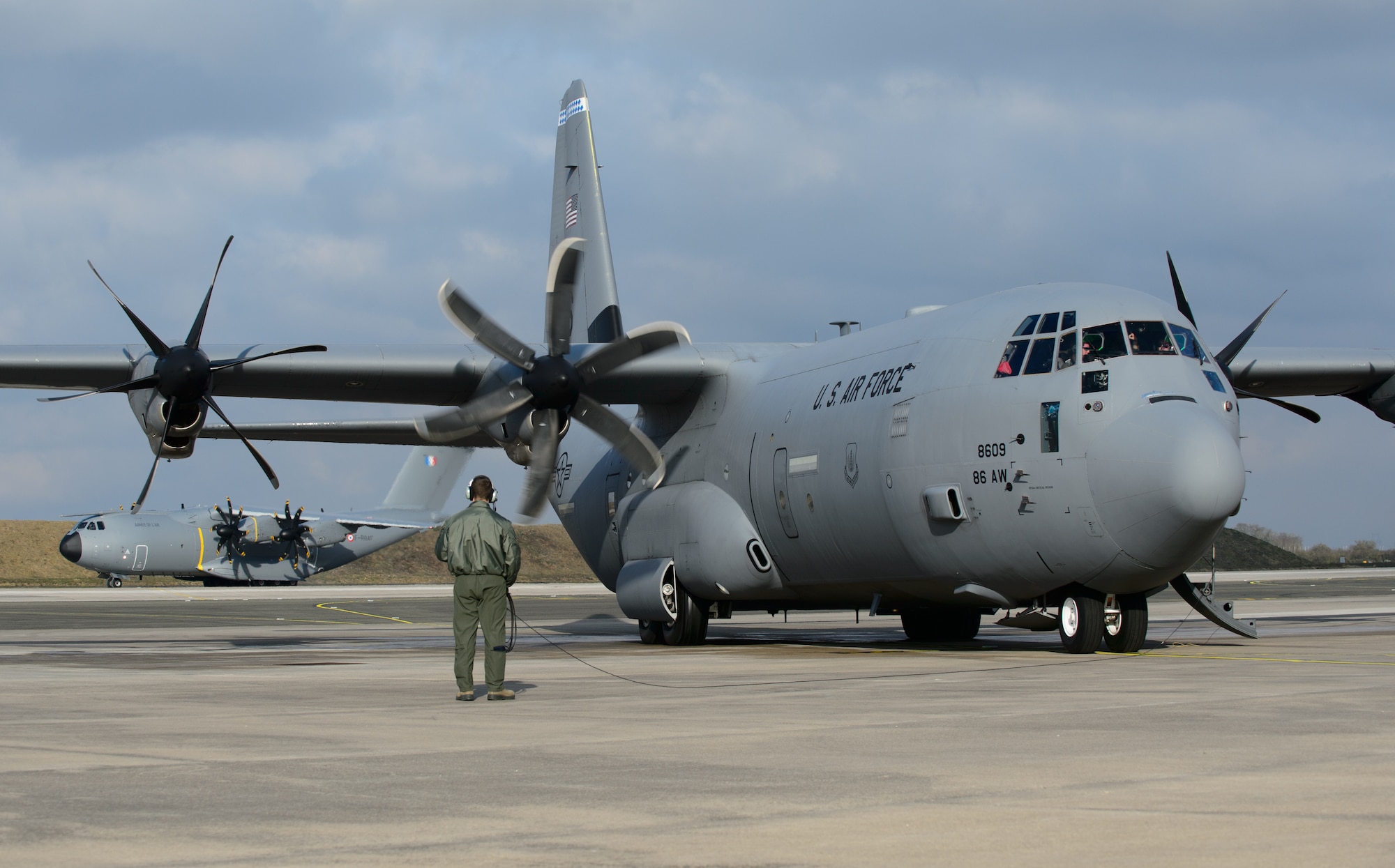Tech. Sgt. James Moenning, 37th Airlift Squadron loadmaster, ensures the engines of his C-130J Super Hercules work properly prior to taking off at Orleans - Bricy Air Base, France, Jan. 21, 2015. The C-130 and its Airmen joined a French aircraft in developing and honing tactical airlift skills during exercise Volfa 15-1. (U.S. Air Force photo/Senior Airman Armando A. Schwier-Morales)