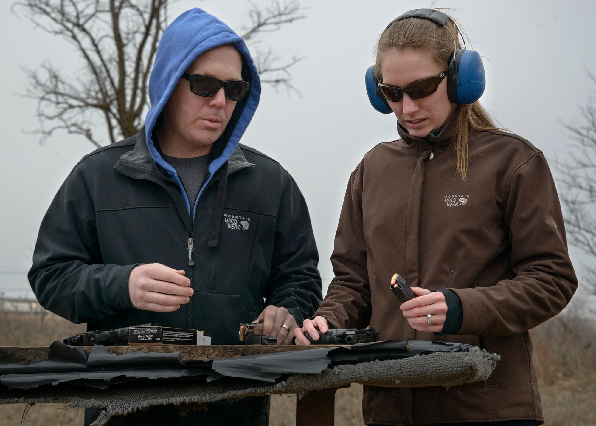 Vance Air Force Base, Okla. -- Lt. Tyler Ringwald, a 33rd Flying Training Squadron instructor pilot, and his wife Kyra learn how to safely handle pistols Jan. 11 during a “concealed carry” class at a private residence west of Enid, Oklahoma. The couple joined more than 20 other 33rd FTS Airmen and family members Jan. 6-11 as they learned fundamentals needed to qualify for an Oklahoma “concealed carry” license. (U.S. Air Force Photo / David Poe)