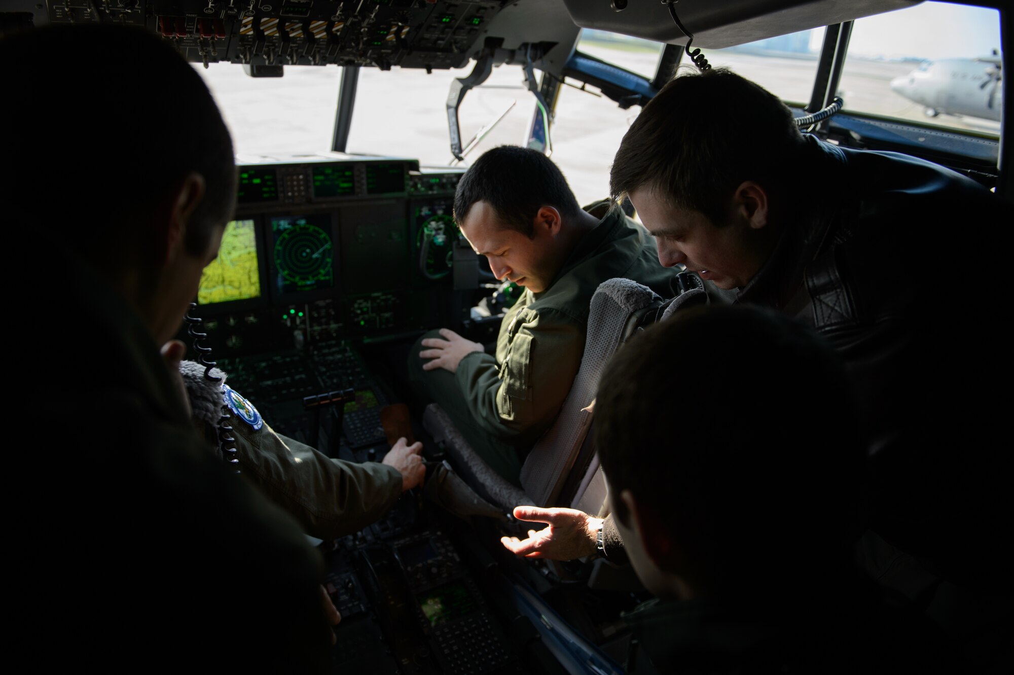 Capt. Matthew Zimmerman, 86th Operations Support Squadron wings tactics chief, demonstrates some of the differences between the U.S. C-130J Super Hercules and the French C-130H Hercules at Orleans - Bricy Air Base, France, Jan. 21, 2015. Zimmerman gave a tour of the aircraft as a way to share knowledge, ideas and develop the partnership between the U.S. and French Air Forces.  (U.S. Air Force photo/Senior Airman Armando A. Schwier-Morales)