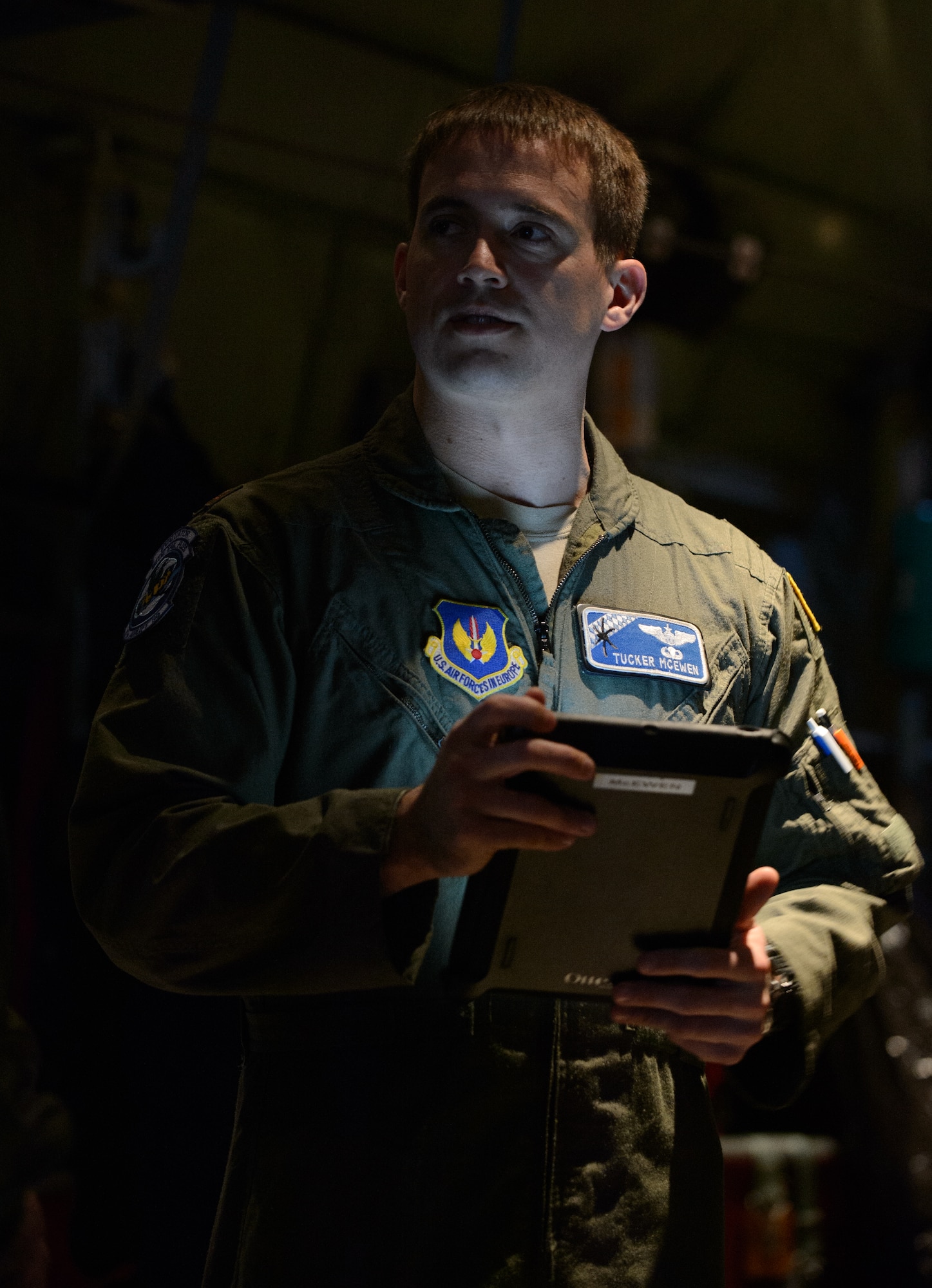 Maj. Tucker McEwen, 37th Airlift Squadron pilot, discusses the upcoming mission with his crew during exercise Volfa 15-1 at Ramstein Air Base, Germany Jan. 21, 2015. McEwen and his crew  participated in a low-level tactical drop lead by a French C-130H Hercules. (U.S. Air Force photo/Senior Airman Armando A. Schwier-Morales)