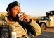 Airman 1st Class Victor Shanks, 39th Security Forces Squadron response team member, drinks hot chocolate Jan. 23, 2015, at Incirlik Air Base, Turkey. Several first sergeant’s and members of the base chapel surprised units around base with deliveries of cookies and hot chocolate as part of a morale event. (U.S. Air Force photo by Senior Airman Krystal Ardrey/Released)