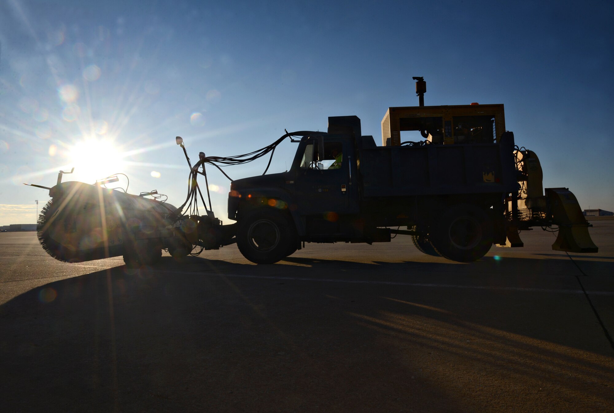 Tinker Support Services Pavements Section is ready for winter weather. With their three sweepster airfield brooms (shown), two Oshkosh snow plows and an Oshkosh snow blower, the 14-member group can serve their mission to keep the airfield clean and allow the alert planes to deploy in approximately 25 minutes. Their subcontractors are also prepared to take care of the roads and parking lots around base when they become slick and hazardous. (Air Force photo by Kelly White)