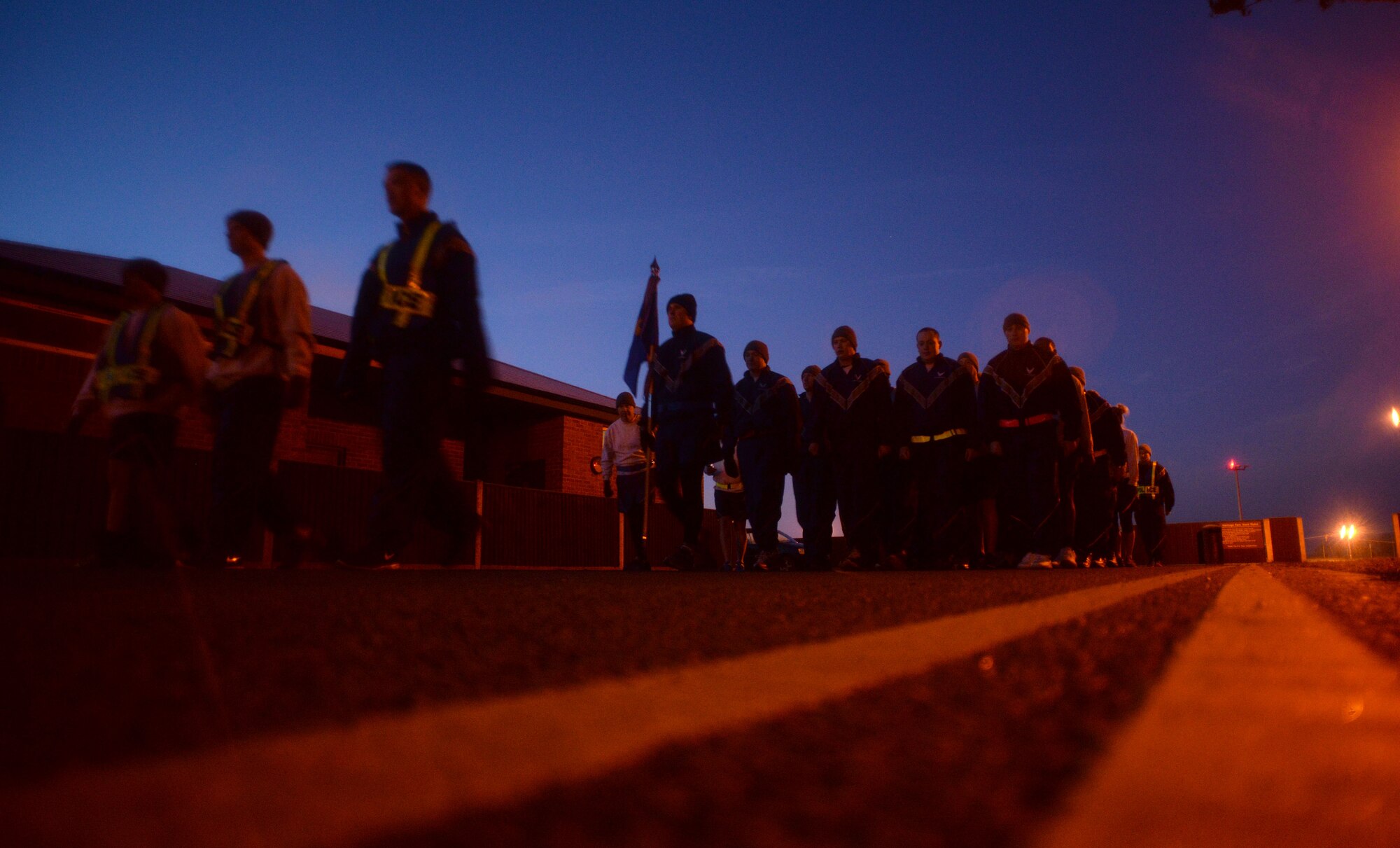 U.S. Air Force Airmen from the 100th Security Forces Squadron march prior to their formation run Jan. 23, 2015, on RAF Mildenhall, England. The 100th SFS formation run is held on a monthly basis for the 100th Air Refueling Wing’s training day. (U.S. Air Force photo by Senior Airman Christine Griffiths/Released)