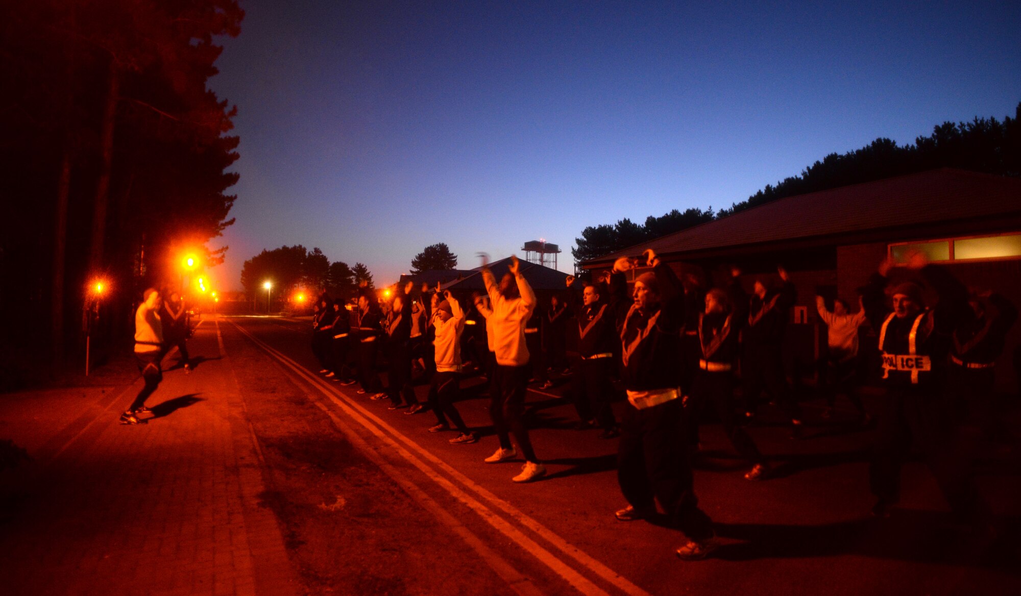 U.S. Air Force Airmen from the 100th Security Forces Squadron warm up prior to their formation run Jan. 23, 2015, on RAF Mildenhall, England. The 100th SFS  kicks off their training days with formation runs. (U.S. Air Force photo by Senior Airman Christine Griffiths/Released)