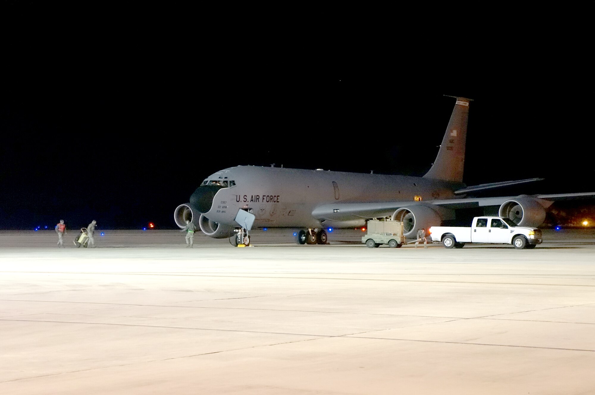 A crew from McConnell Air Force Base, Kan., services their KC-135 Stratotanker while temporarily at Robins. The 22nd Air Refueling Wing brought five of the aircraft here to participate in an exercise. (U.S. Air Force photo by Ed Aspera)