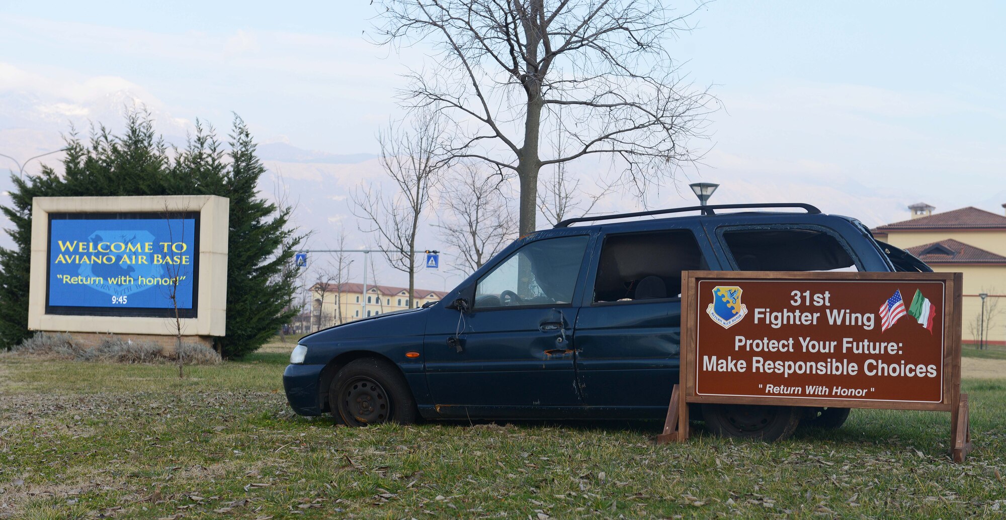A crashed vehicle is displayed at the South Gate entrance, Jan. 14, 2015, at Aviano Air Base, Italy. Last year, Aviano experienced 363 vehicle accidents. Members are reminded to stay safe and remain vigilant while driving. (U.S. Air Force photo/Airman 1st Class Deana Heitzman)
