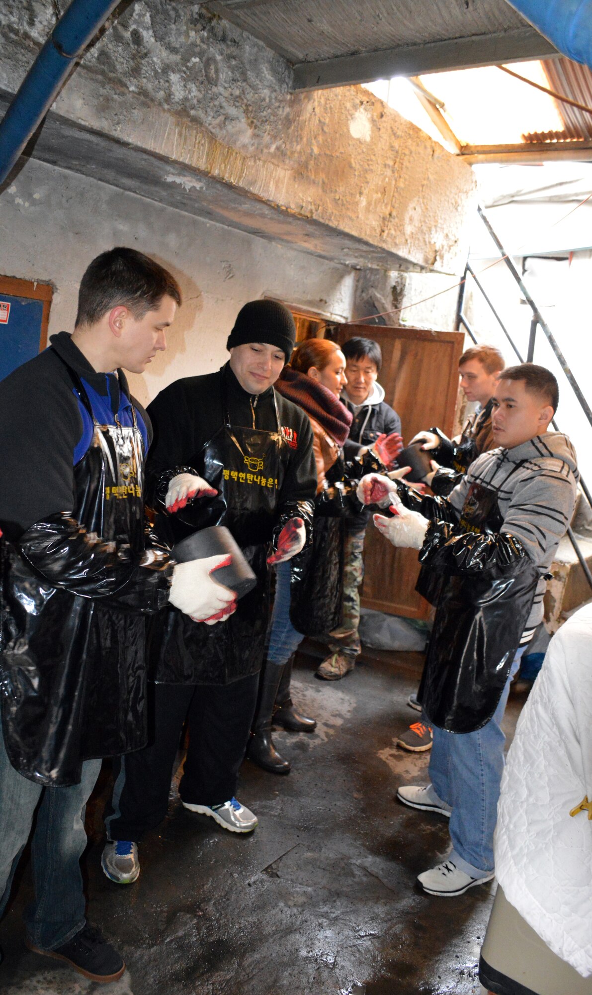 Volunteers from Osan Air Base, Republic of Korea, assist in coal delivery Jan. 22, 2015 in Songtan, ROK.  Members of Seventh Air Force A2S raised over 2M Won which was used to buy 5,000 coal briquettes, locally called “yeontan.”  The yeonton is being delivered to 27 homes in need.  Each home will be provided with enough to last about three months.  (U.S. Air Force photo by Master Sgt. Marelise Wood) 