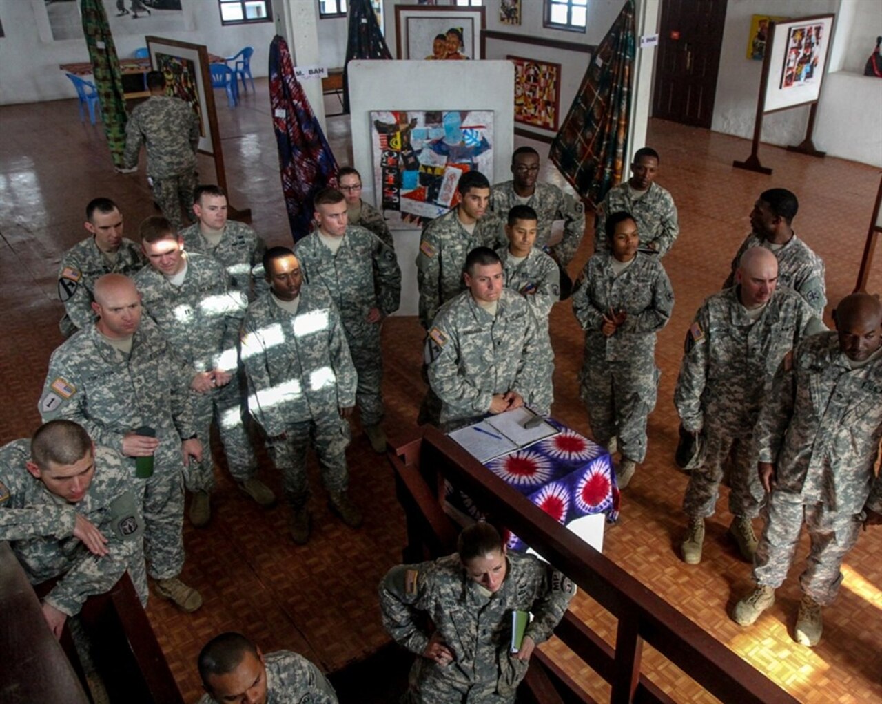 Joint Forces Command – United Assistance service members, deployed to Barclay Training Center, Monrovia, Liberia, take a tour of the Liberian National Museum, Jan. 20, 2015, in Monrovia. The JFC-UA sponsored museum visit was initiated to allow service members deployed in support of Operation United Assistance to more fully understand and experience Liberian culture. The museum has three floors, each one dedicated to a different medium. The third floor displays prints of historic photos. Operation United Assistance is a Department of Defense operation in Liberia to provide logistics, training and engineering support to U.S. Agency for International Development-led efforts to contain the Ebola virus outbreak in western Africa. U.S. Army photo by Spc. Caitlyn Byrne, 27th Public Affairs Detachment