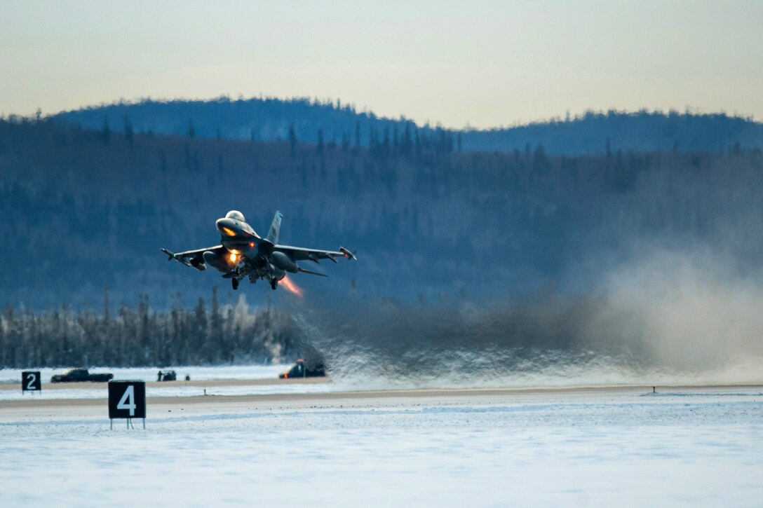 A U.S. Air Force F-16 Fighting Falcon aircraft takes off from Eielson Air Force Base, Alaska, Jan. 17, 2015.