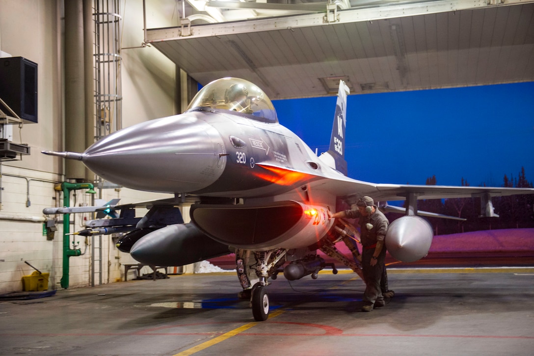 Air Force Tech. Sgt. Shane Morris prepares an F-16 Fighting Falcon aircraft on Eielson Air Force Base, Alaska, Jan. 17, 2015. Morris is a crew chief assigned to the 354th Aircraft Maintenance Squadron.  The airmen are in transit to Joint Base Pearl Harbor-Hickam, Hawaii, and Andersen Air Force Base, Guam, to participate in the Sentry Aloha and Cope North exercises.