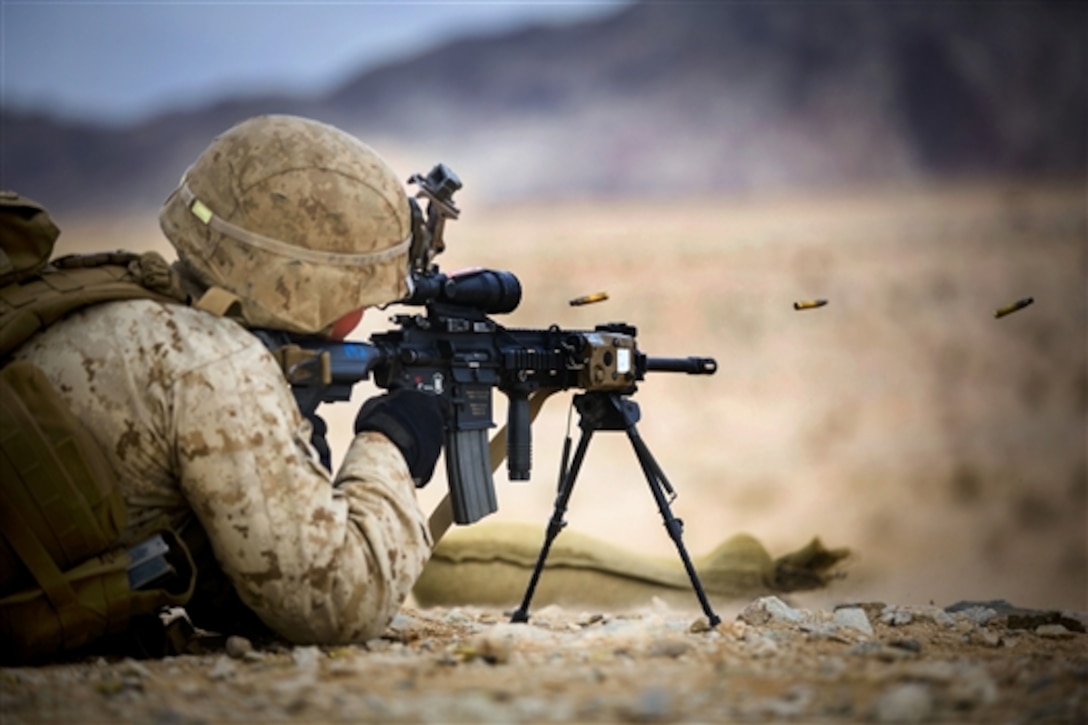Marine Corps Lance Cpl. Dacotah E. Roskop fires an M27 infantry automatic rifle down range on Camp Wilson, Marine Corps Air Ground Combat Center Twentynine Palms, Calif., Jan. 20, 2015. Roskop is an automatic rifleman assigned to Fox Company, 2nd Battalion, 3rd Marine Regiment.