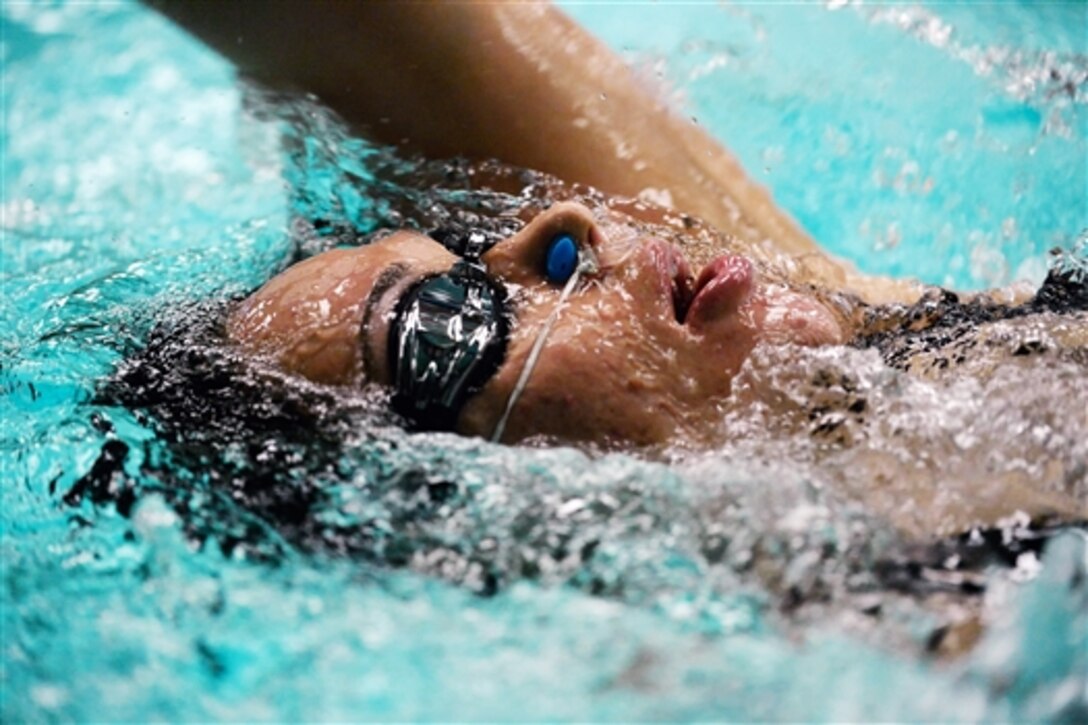 A recovering service member participates in swimming exercises during the Air Force Wounded Warrior Adaptive Sports and Reconditioning Camp at the Judson Aquatic Center in Universal City, Texas, Jan. 21, 2015. More than 80 Air Force recovering service members from around the nation participated in the weeklong adaptive sports camp, Jan. 19-23. 