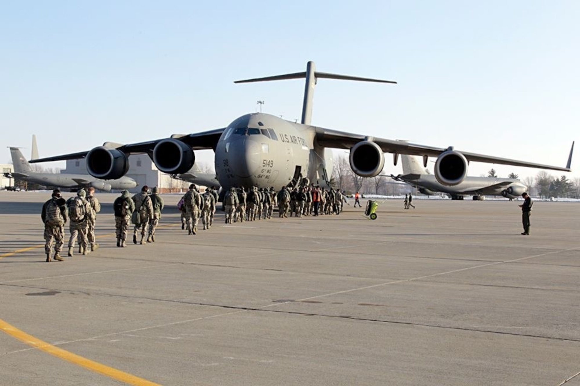 Airmen from the 127th Wing board a C-17 Globemaster at Selfridge Air National Guard Base, Mich., on Friday, January 23, as they head to Davis-Monthan AFB, Ariz. for Operation Snobird.  Approximately 200 Michigan Airmen will deploy for the annual training in warmer weather and optimal training conditions.  The C-17 is from the 154th Wing, Hawaii Air National Guard. (U.S. Air National Guard photo by Tech. Sgt. Dan Heaton)