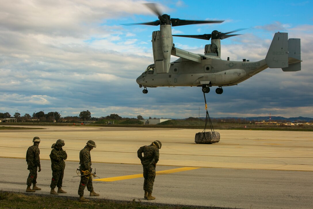 An MV-22 Osprey from Special-Purpose Marine Air-Ground Task Force Crisis Response-Africa drops a 2180-pound pallet during an external-lift drill at Morón Air Base, Spain, Jan. 19, 2015. The vertical-lift capabilities of the Osprey allowed teams on the ground to rapidly attach large loads without the need to land the aircraft. (U.S. Marine Corps photo by Sgt. Paul Peterson)