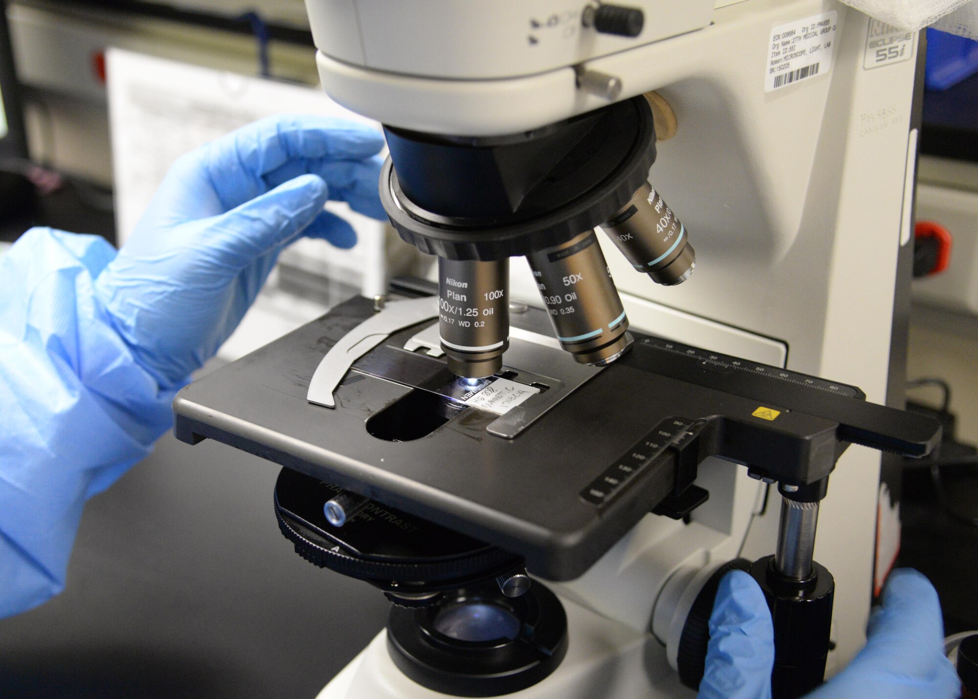 A U.S. Air Force Airman with 27th Special Operations Medical Group prepares lab slides Jan. 21, 2015 at Cannon Air Force Base, N.M. The group maintains a robust role in the Aerospace Expeditionary Force mission and has provided significant levels of combat medical support. (U.S. Air Force photo/Staff Sgt. Alexxis Mercer) 