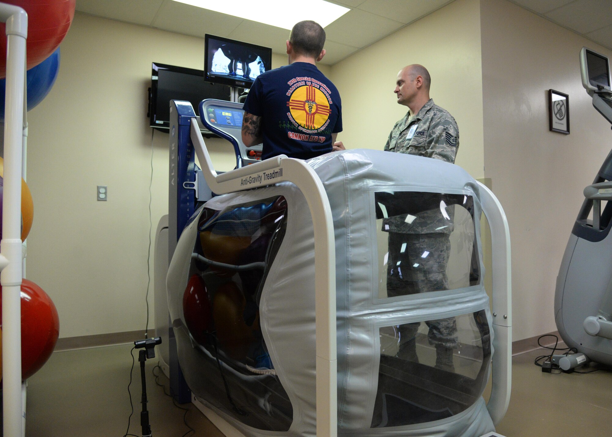 U.S. Air Force Tech. Sgt. John Welch, 27th Special Operations Medical Operations Squadron, helps a patient during physical therapy Jan. 21, 2015 at Cannon Air Force Base, N.M. The clinic is able to use unique equipment to help rehabilitate Air Commandos experiencing pain during normal activities. (U.S. Air Force photo/Staff Sgt. Alexxis Mercer) 