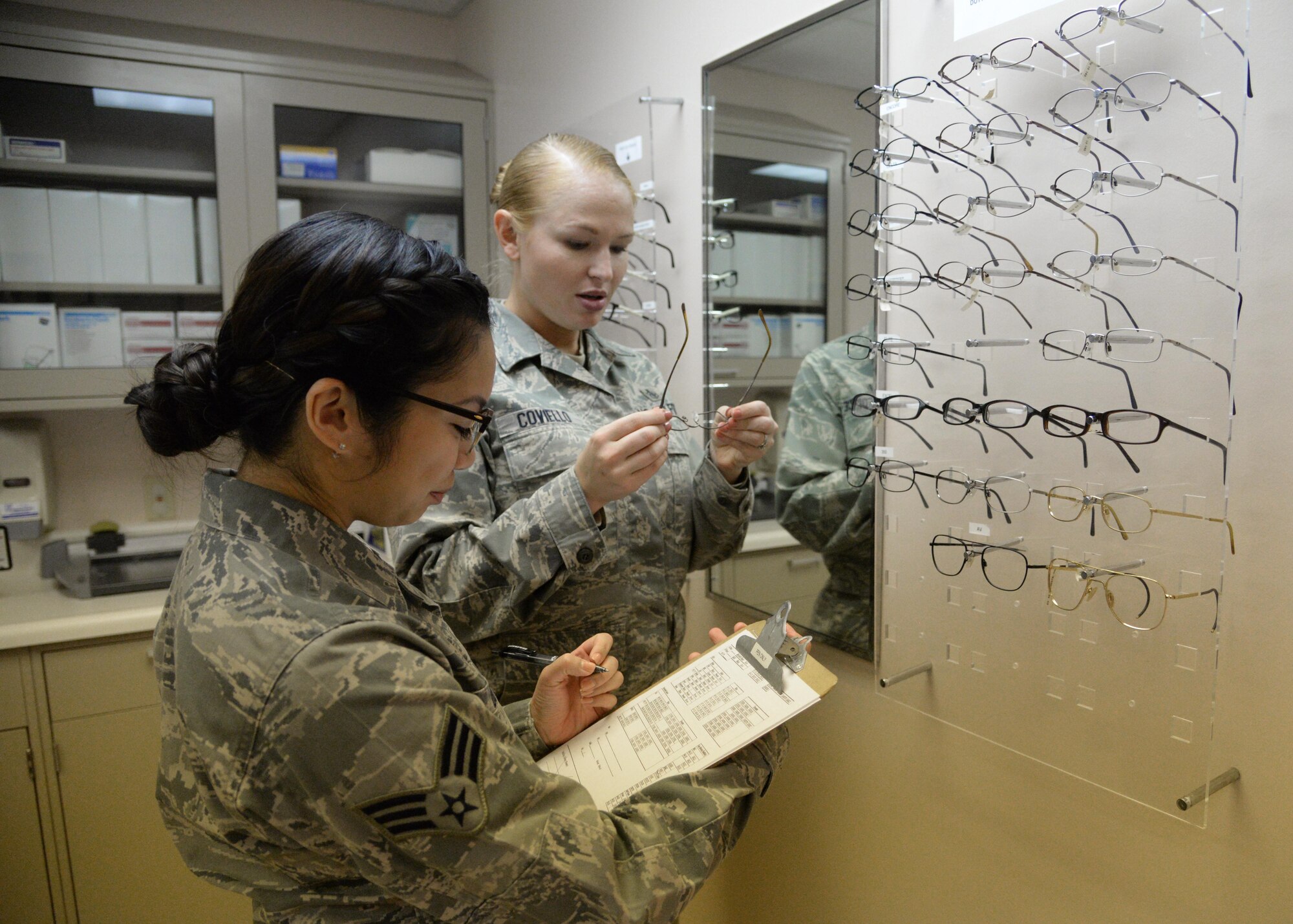 U.S. Air Force Senior Airman Sang Do, 27th Special Operations Aerospace Medicine Squadron, helps an Air Commando select corrective lens frames Jan. 21, 2015 at Cannon Air Force Base, N.M. As an ambulatory care facility, the medical group provides a wide range of services to include everything from pediatrics and optometry, to flight medicine, dental, public health and physical therapy. (U.S. Air Force photo/Staff Sgt. Alexxis Mercer) 