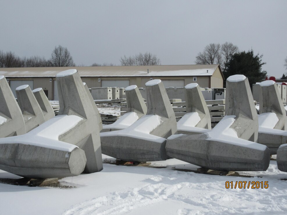 In 2015 the Cleveland and Oswego harbor breakwaters will be repaired using dolos that are currently being constructed. 

A dolos is a concrete block in a complex geometric shape used in great numbers to protect harbor walls from the erosive force of wave action.