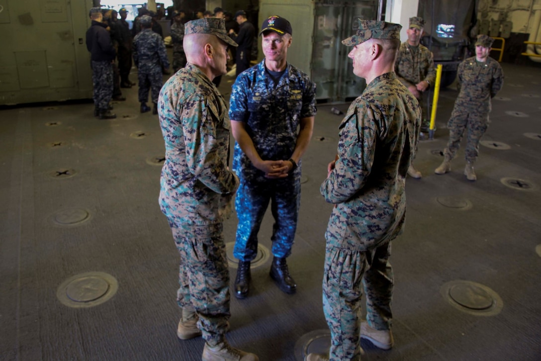 U.S. Marine Maj. Gen. Vincent A. Coglianese, left, speaks to Navy Capt. Peter M. Mantz and Marine Col. Vance L. Cryer aboard USS Essex (LHD 2) at Naval Base San Diego Jan. 24, 2014. Coglianese is the commanding general of 1st Marine Logistics Group. Mantz is the commanding officer of the USS Essex. Cryer is the commanding officer of the 15th Marine Expeditionary Unit. USS Essex is part of the Essex Amphibious Ready Group which is scheduled to deploy with the 15th MEU this spring. (U.S. Marine Corps photo by Cpl. Elize McKelvey/Released)